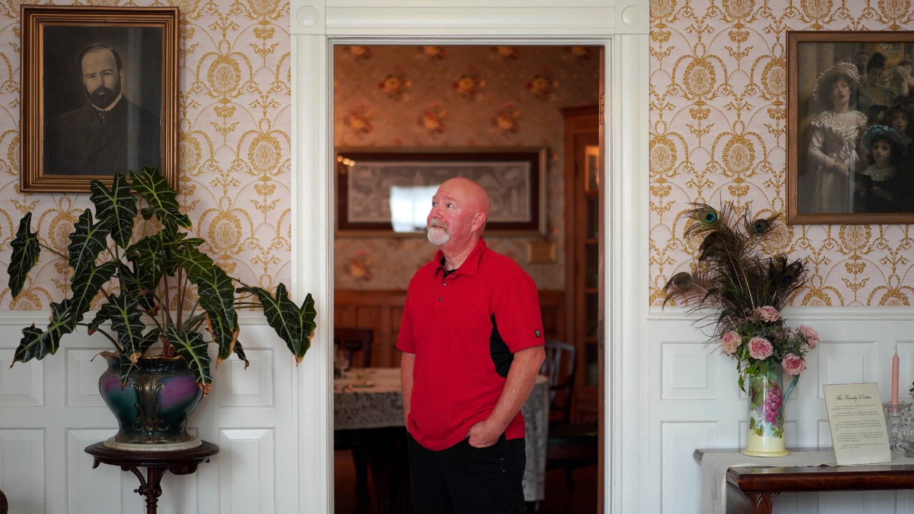 Mike McDowell, a board member for the Zion Historical Society and an associate pastor at Christ Community Church, stands for a portrait in the Historic Shiloh House, once owned by the town’s founder, John Alexander Dowie. McDowell's great grandparents moved to Zion in 1905 from North Dakota because his great grandmother believed Dowie, a known faith healer, cured her whooping cough. (AP Photo / Jessie Wardarski)