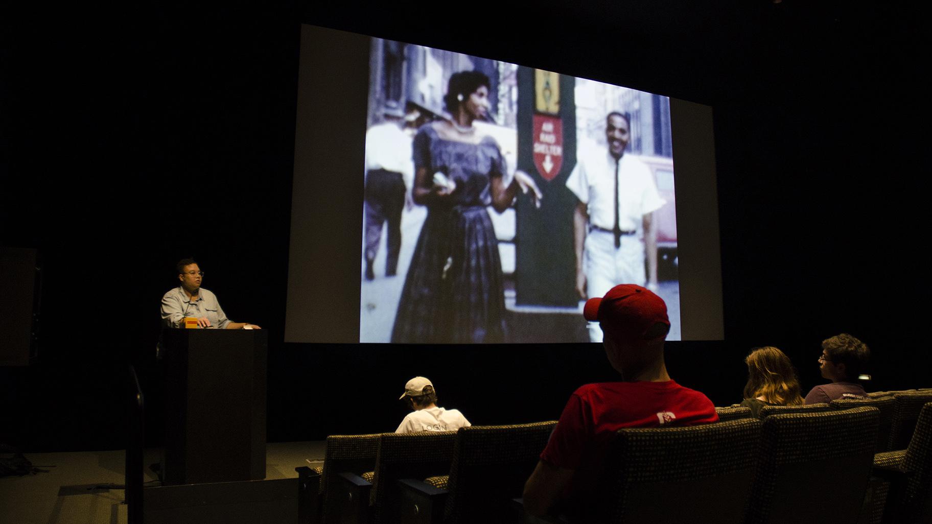 Candace Ming exhibits footage with a donor at the Five Year Anniversary Bash at the Logan Center for the Arts at the University of Chicago, October 7, 2017. (Courtesy South Side Home Movie Project)