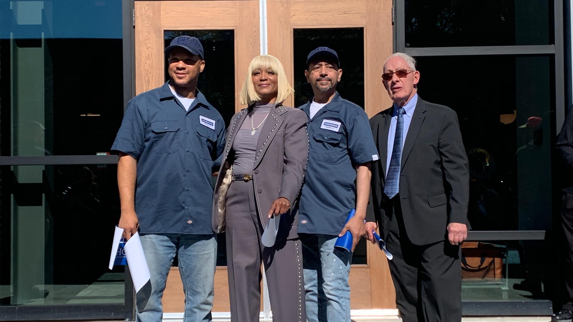 From left, Juice WRLD’s brother and head of brewing operations at Homewood Brewing Company Brian Wallace, Juice WRLD’s mother and brewpub owner Carmela Wallace, head chef Robert Lauderdale and Homewood Mayor Richard Hofeld following ribbon-cutting ceremony on Oct. 18, 2024. (Eunice Alpasan / WTTW News)