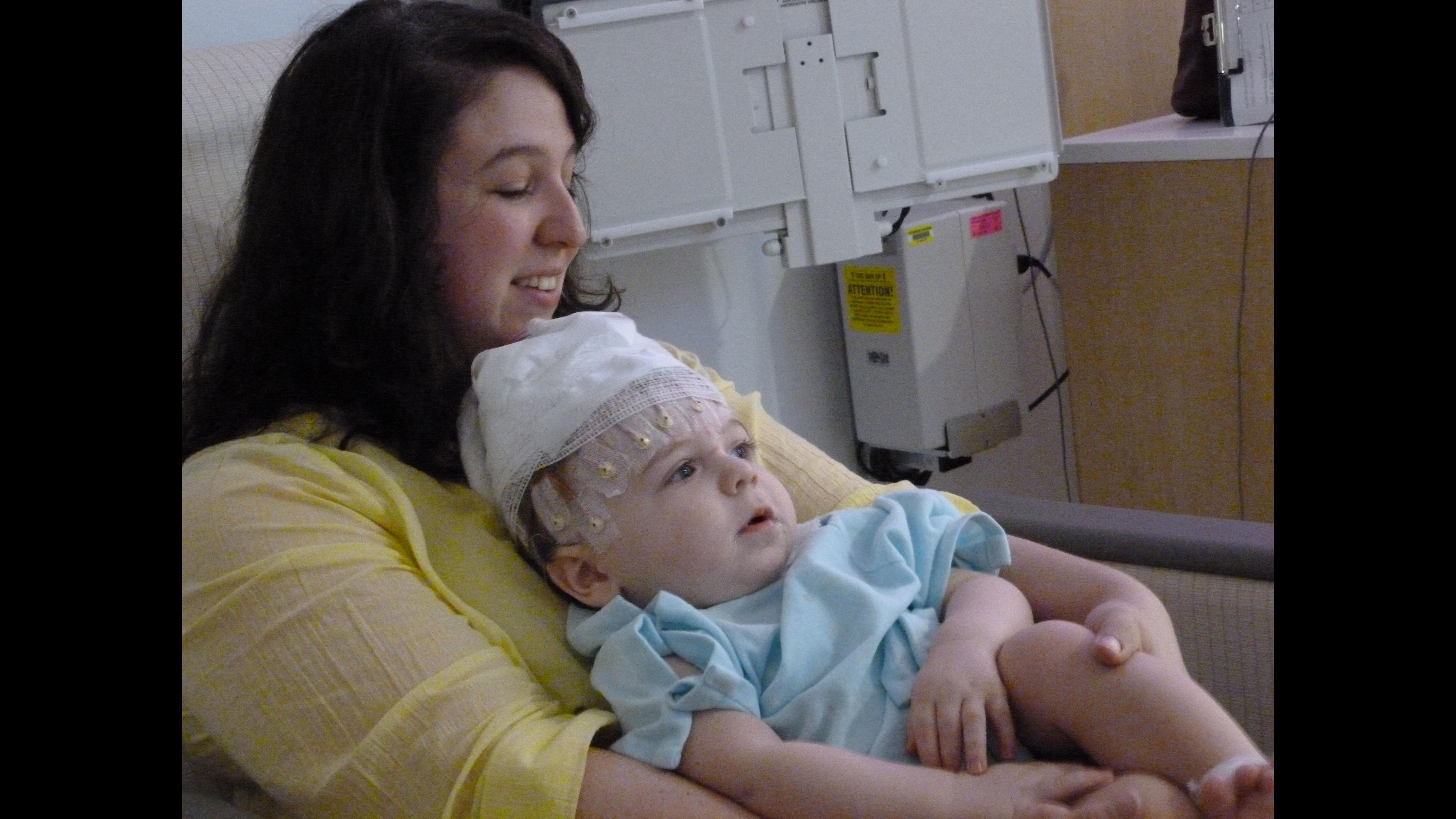Ellen Wehrman and her son, Charlie, spend his first birthday preparing for an EEG. Wehrman, a former Loyola University Chicago student activities coordinator, will receive an award this week for raising awareness of infantile spasms, a rare disorder. (Courtesy Ellen Wehrman)