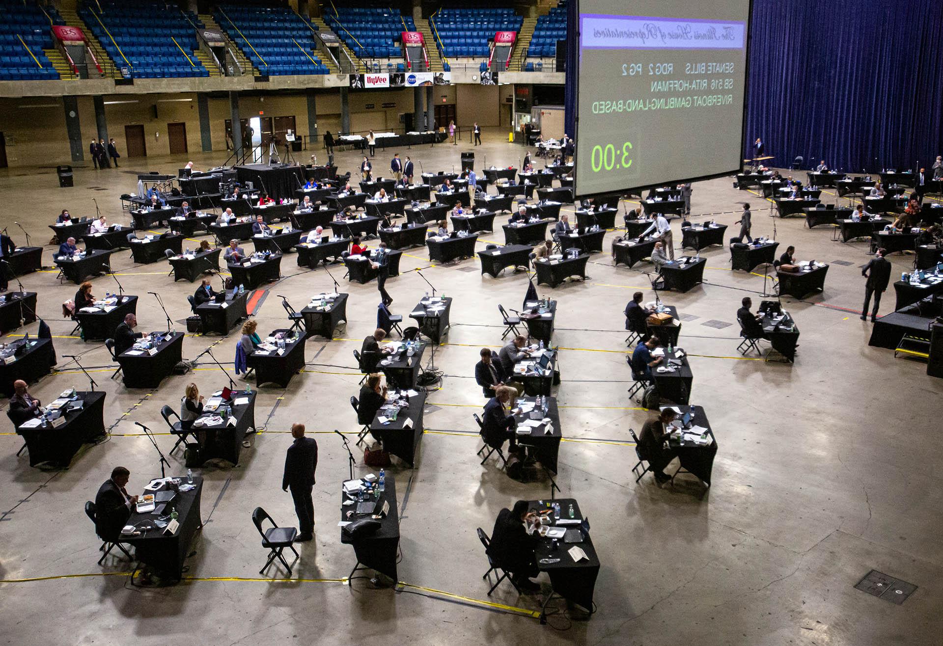 Lawmakers prepare an extended session of the Illinois House of Representatives to begin at the Bank of Springfield Center, May 23, 2020, in Springfield. (POOL PHOTO / Justin L. Fowler / The State Journal-Register)