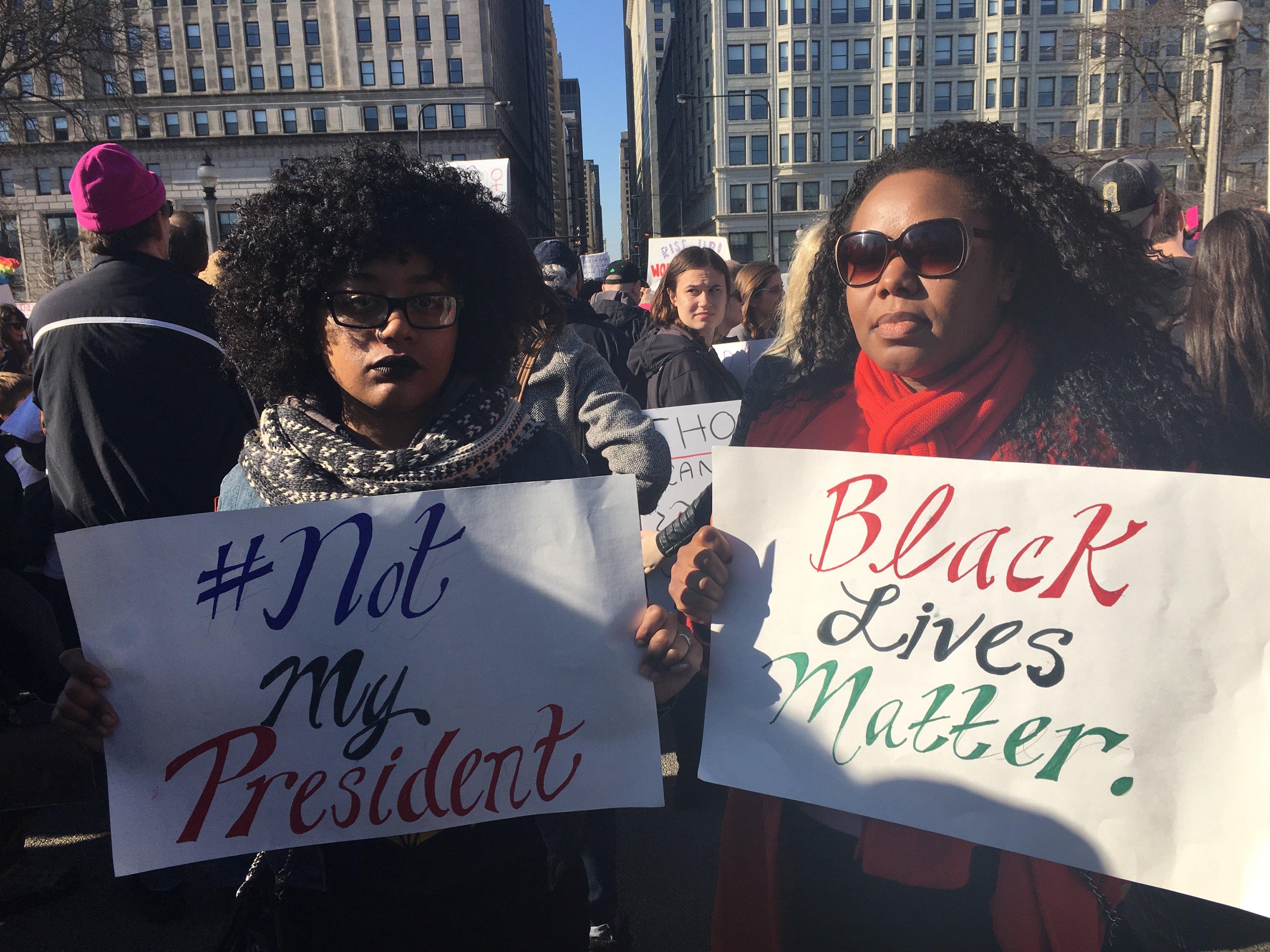 Colette Gregory, right, with her mentee Sara Phillips, 27. The women attended the rally Saturday to “get their voices heard.”