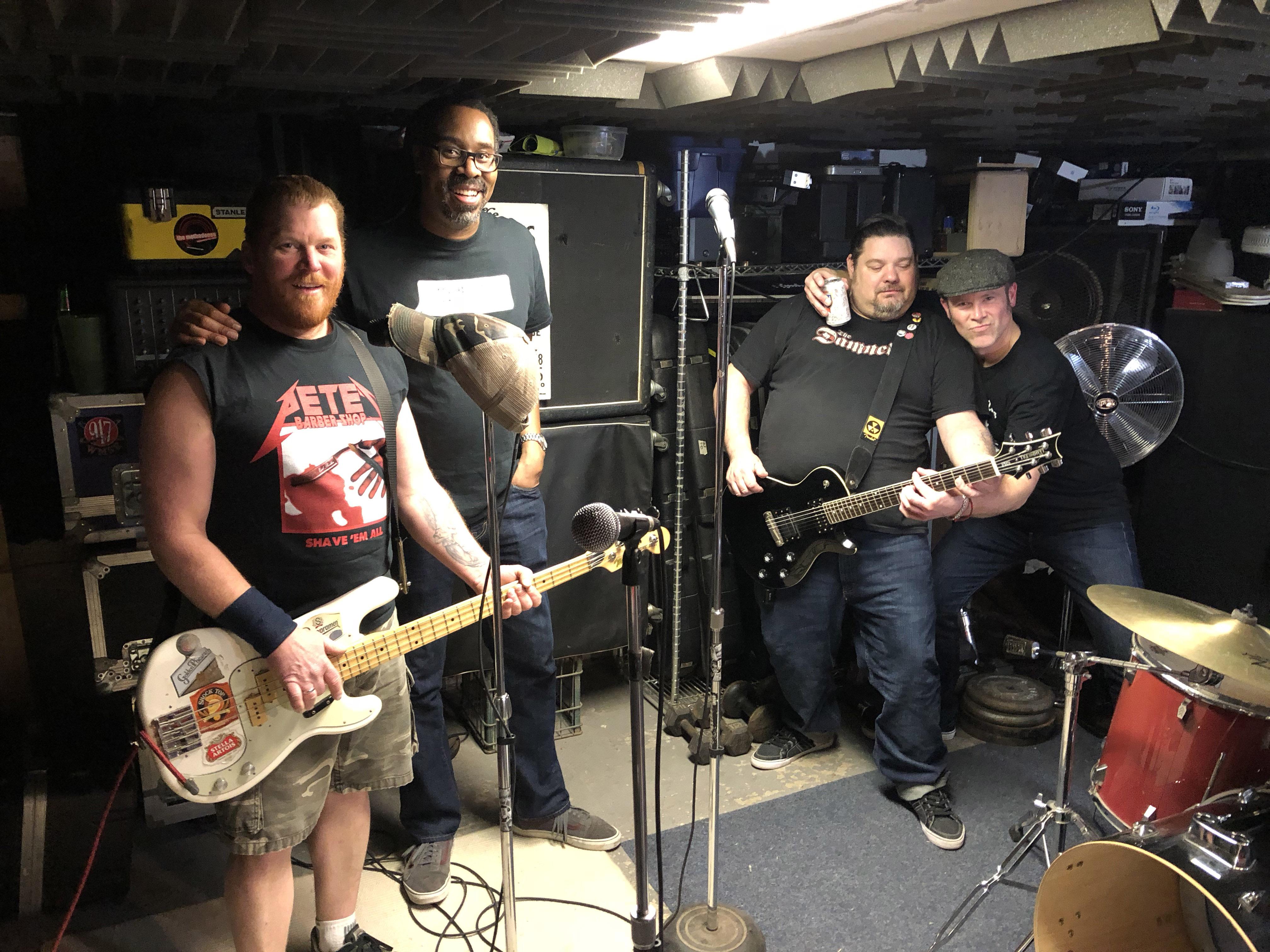 The Bollweevils pose after a rehearsal in a Northwest Side basement. From left: Pete Mittler, Daryl Wilson, Ken Fitzner, Pete Mumford. (Jay Shefsky / Chicago Tonight)