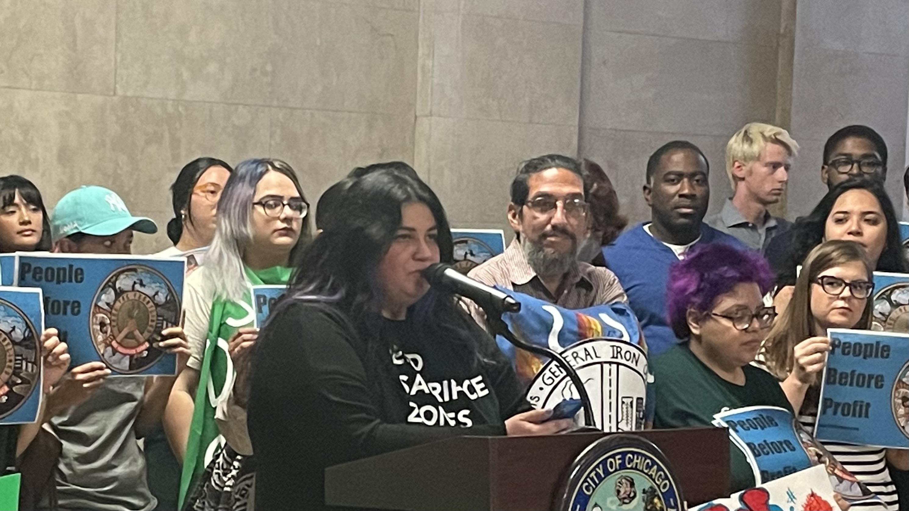 Gina Ramirez, the Midwest outreach manager for the Natural Resources Defense Council, denounces plans for a metal scrapper on Chicago's Southeast Side at City Hall on Tuesday, June 6, 2021. (Heather Cherone/WTTW News)