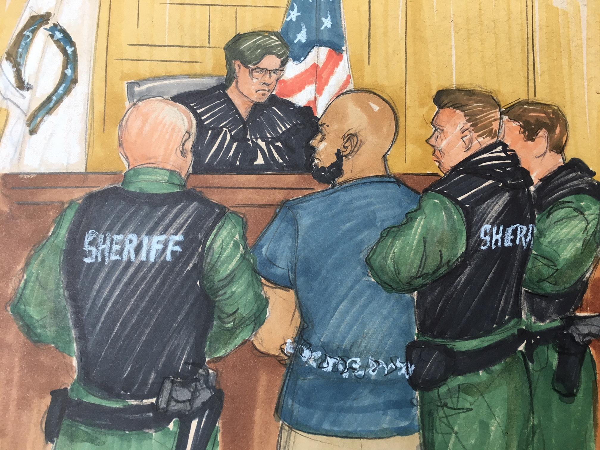 Shomari Legghette, 44, is flanked by a half-dozen heavily armored sheriff’s deputies. (Thomas Gianni sketch)