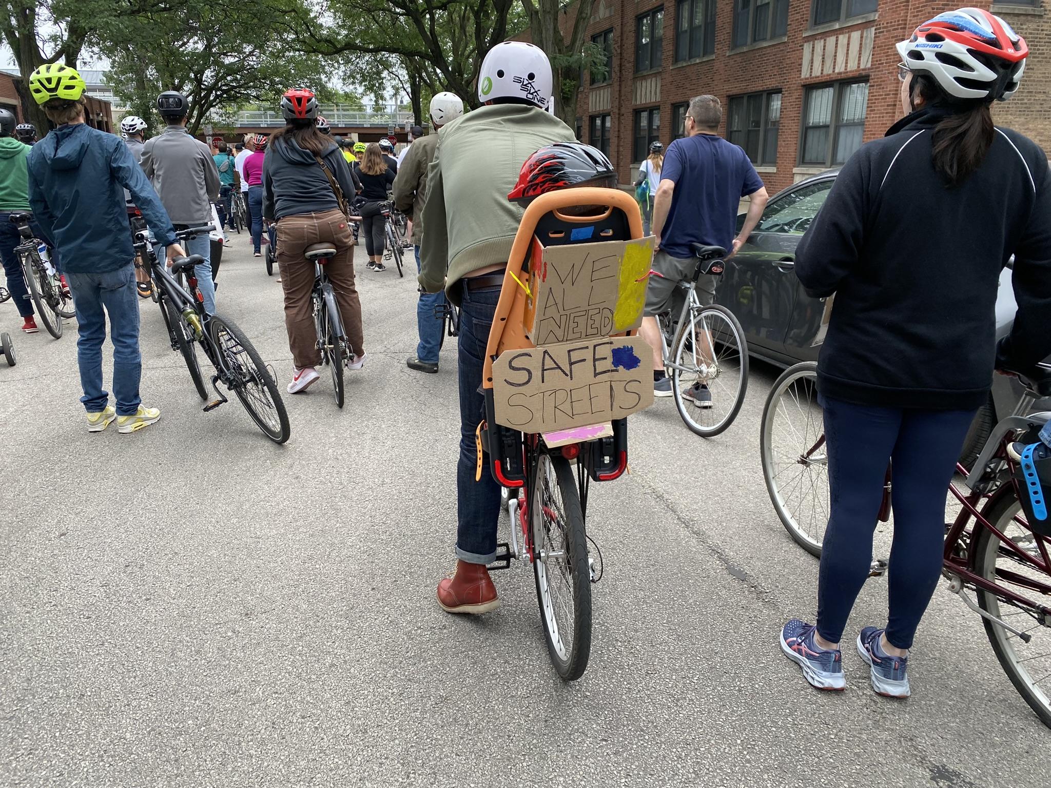 Attendees at a safe streets rally adorned their bikes with calls for change on June 12, 2022. (Nick Blumberg / WTTW News)