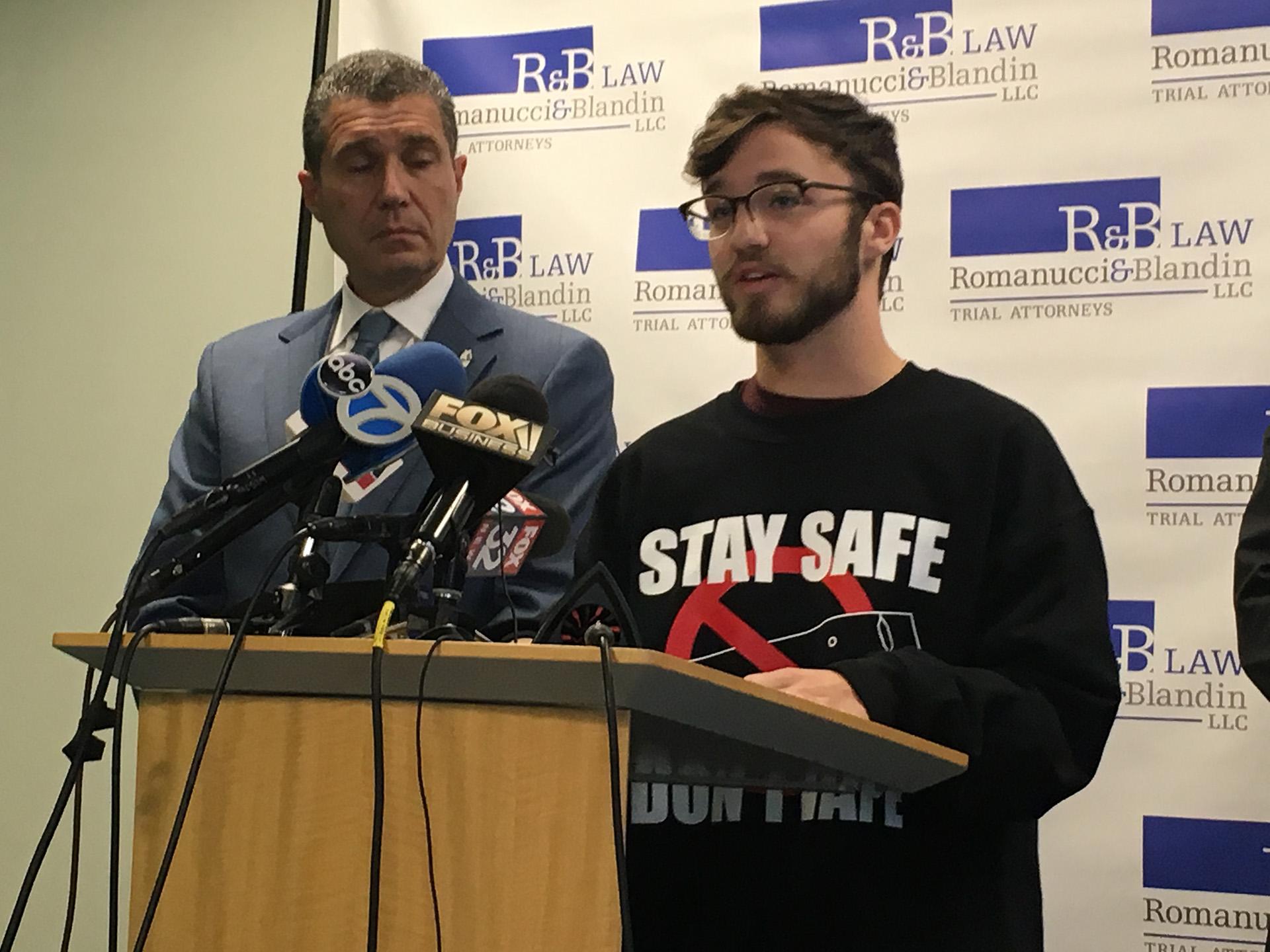 Gurnee resident Adam Hergenreder, 18, right, talks about how he began using e-cigarettes at a Friday, Sept. 13 press conference alongside his attorney Antonio Romanucci. (Kristen Thometz / WTTW News)
