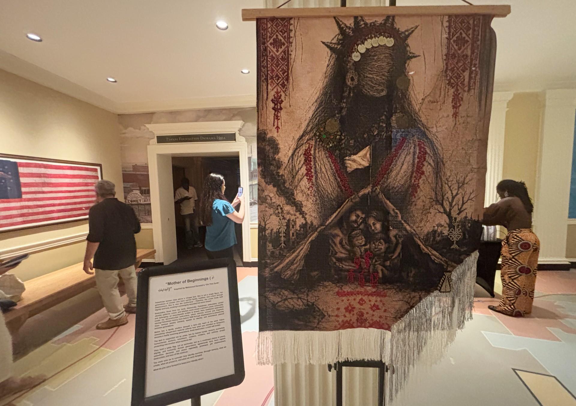 “Mother of Beginnings” by Hama Hinnawi is pictured at “Voices Through Art” on Aug. 20, 2026, at the Chicago History Museum. (Shelby Hawkins / WTTW News)