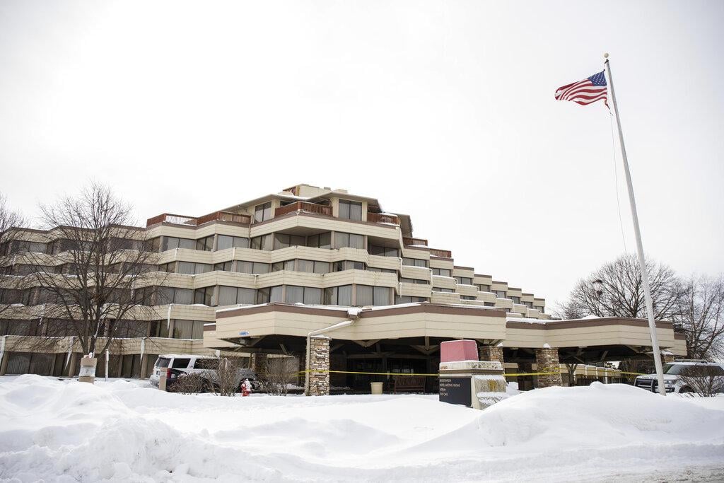 Police investigate the scene of a shooting at the Indian Lakes Hotel on Saturday, Feb. 6, 2021 in Bloomingdale, Ill. (Pat Nabong / Chicago Sun-Times via AP)