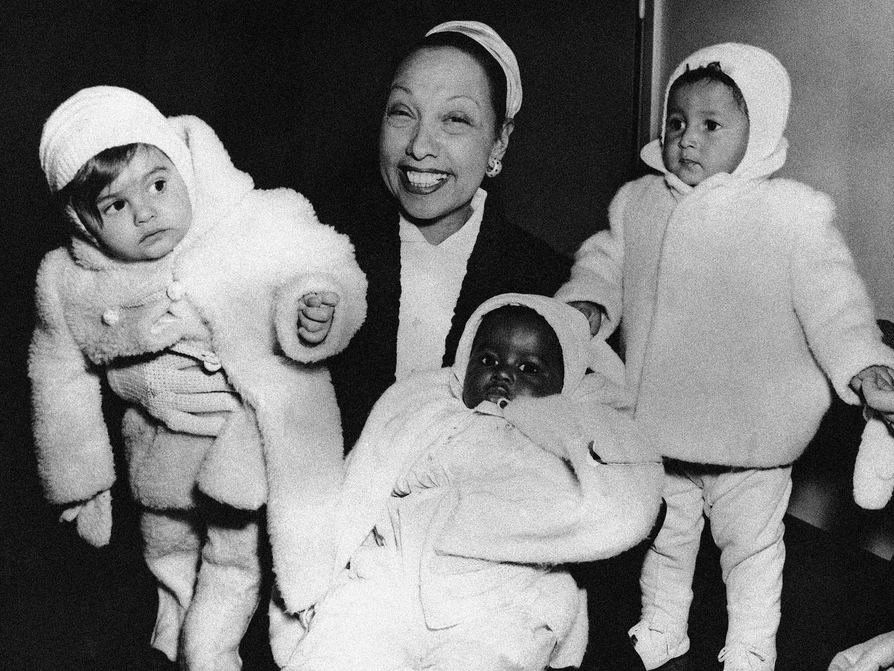 Actress Josephine Baker in her apartment at the Hotel Forresta near Stockholm, Sweden on Dec. 7, 1957, with three of her adopted children, Marianne, left, Koffi, center, and Brahim. (AP Photo, File) 