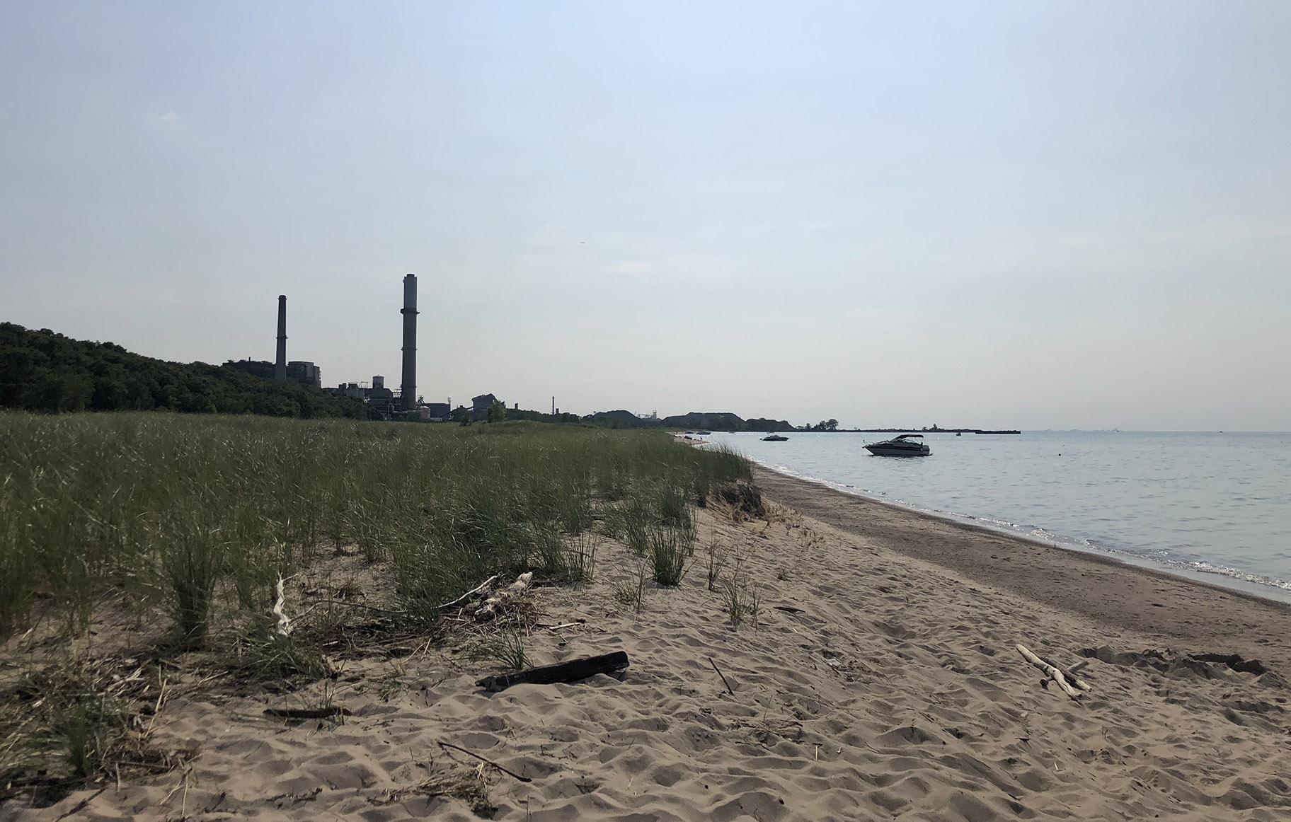 Indiana Dunes National Park, with various industrial plants in the background, in 2019. (Patty Wetli / WTTW News)