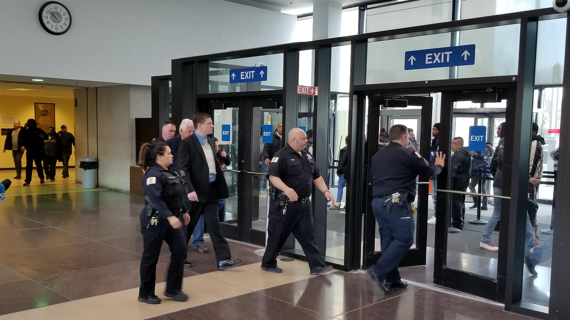Wearing a bulletproof vest, Jason Van Dyke exits the Leighton Criminal Court Building in Chicago on Thursday, March 8, 2018. (Matt Masterson / Chicago Tonight)