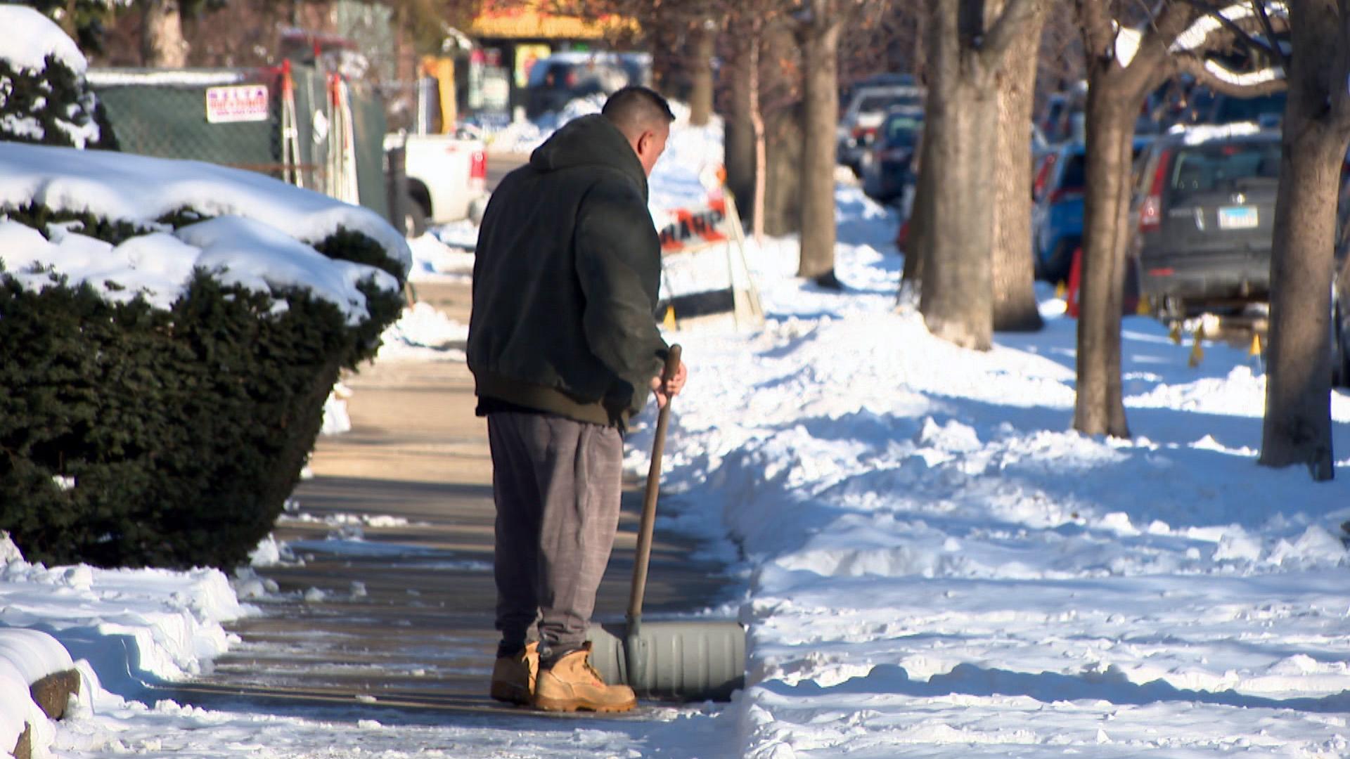 A man shovels the sidewalk in Chicago’s Jefferson Park neighborhood on Thursday, Jan. 28, 2021. (WTTW News)