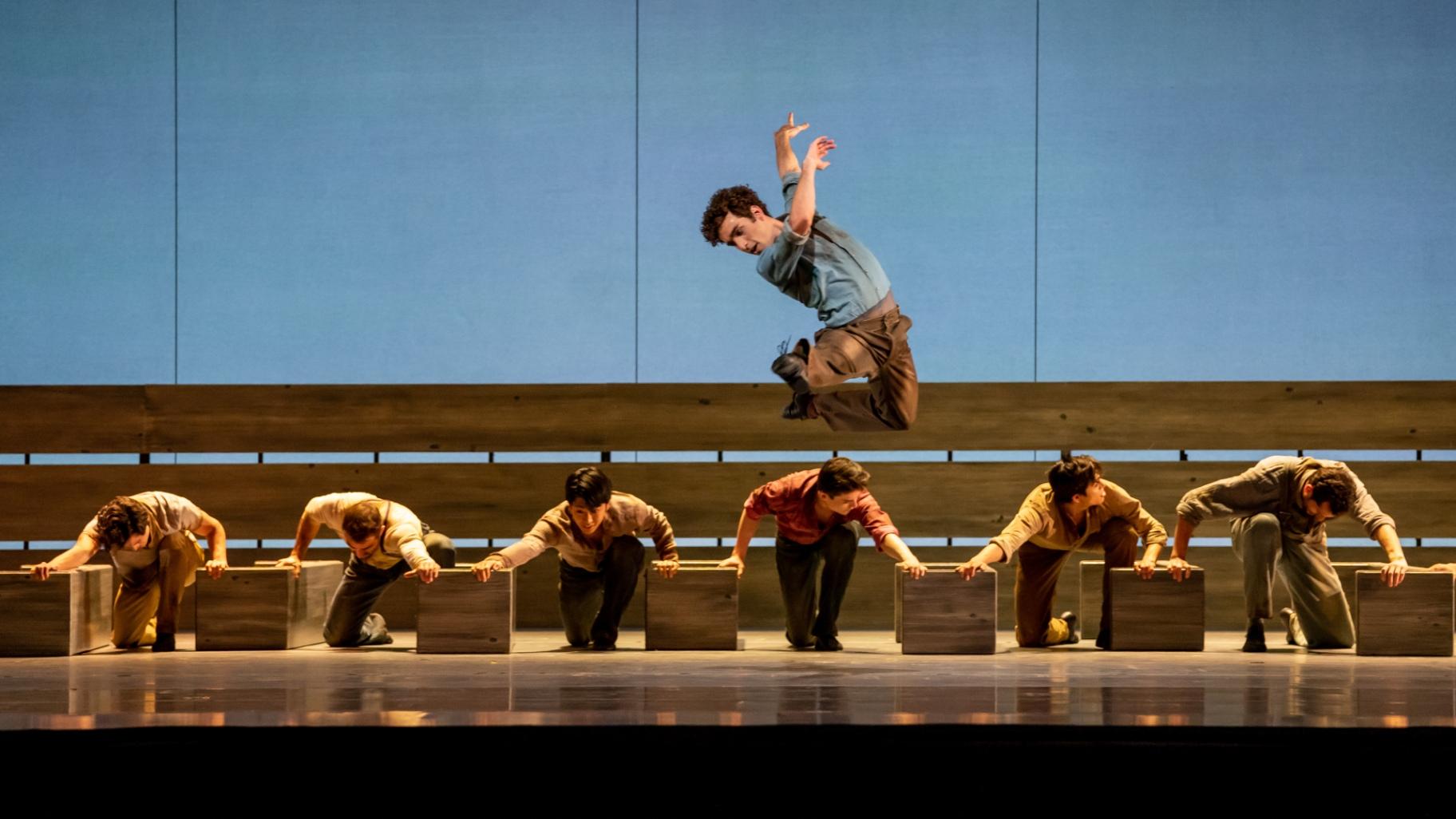Edson Barbosa and the Joffrey Ballet ensemble perform in Cathy Marston’s “Of Mice and Men. (Credit: Cheryl Mann)