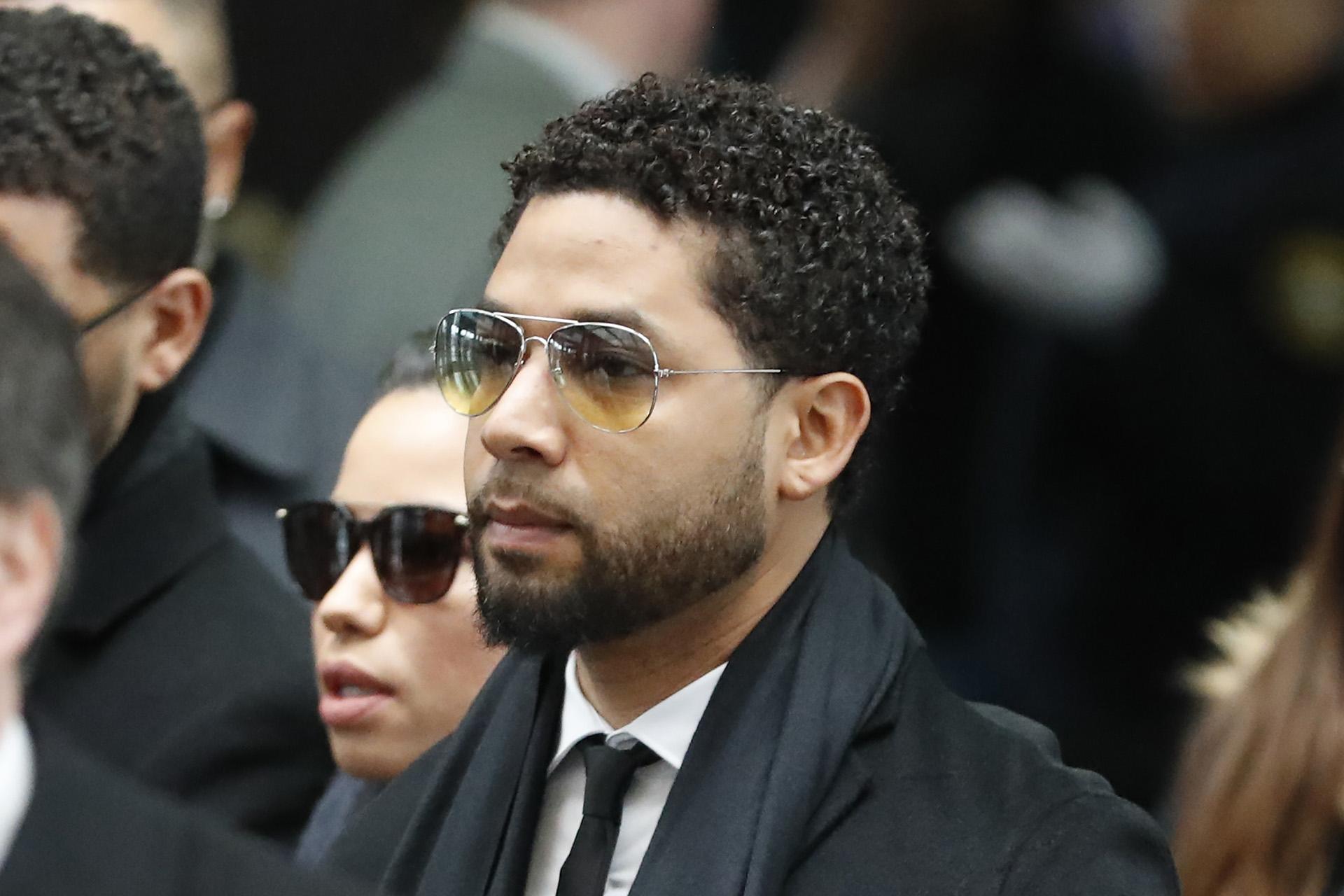 Former “Empire” actor Jussie Smollett, center, arrives for an initial court appearance Monday, Feb. 24, 2020, at the Leighton Criminal Courthouse in Chicago, on a new set of charges alleging that he lied to police about being targeted in a racist and homophobic attack in downtown Chicago early last year.  (AP Photo / Charles Rex Arbogast)