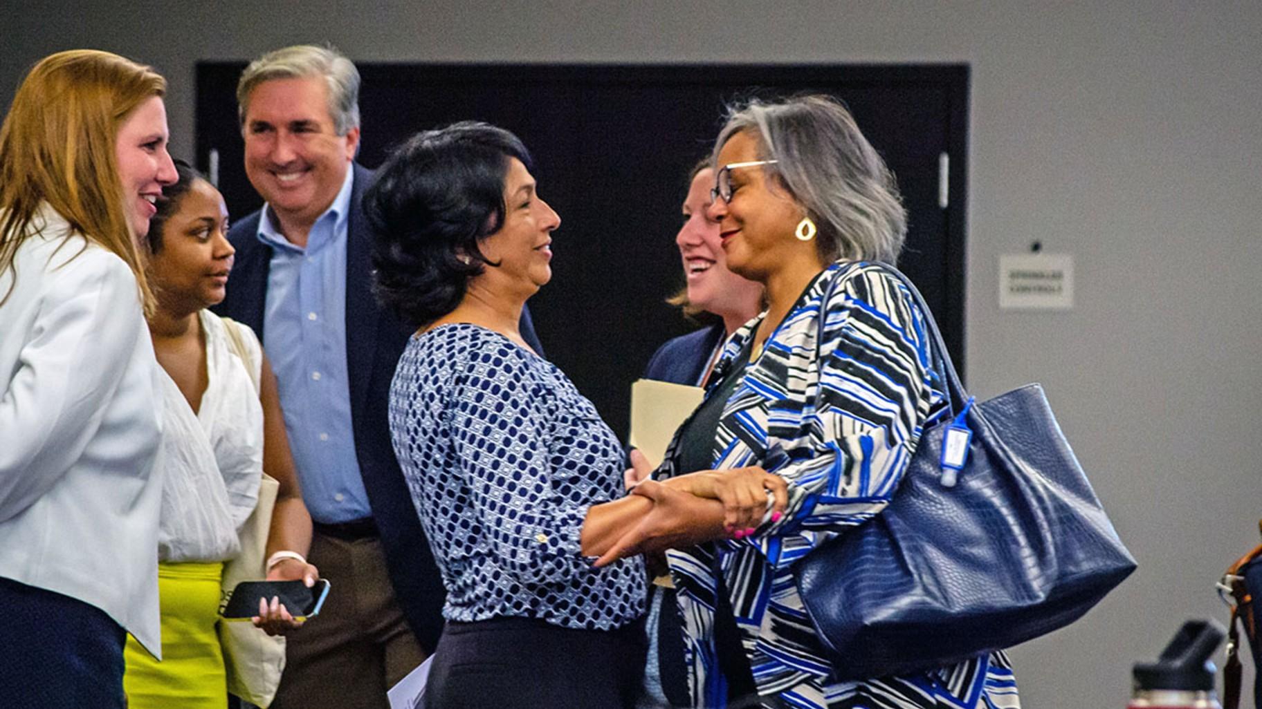 State Rep. Lisa Hernandez embraces U.S. Rep. Robin Kelly in 2022 after unseating her as Democratic Party of Illinois chair. (Jerry Nowicki / Capitol News Illinois)