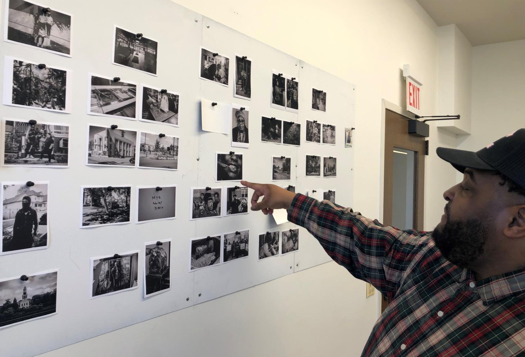 Kenn Cook Jr. displays his photographs. (Marc Vitali / WTTW News)