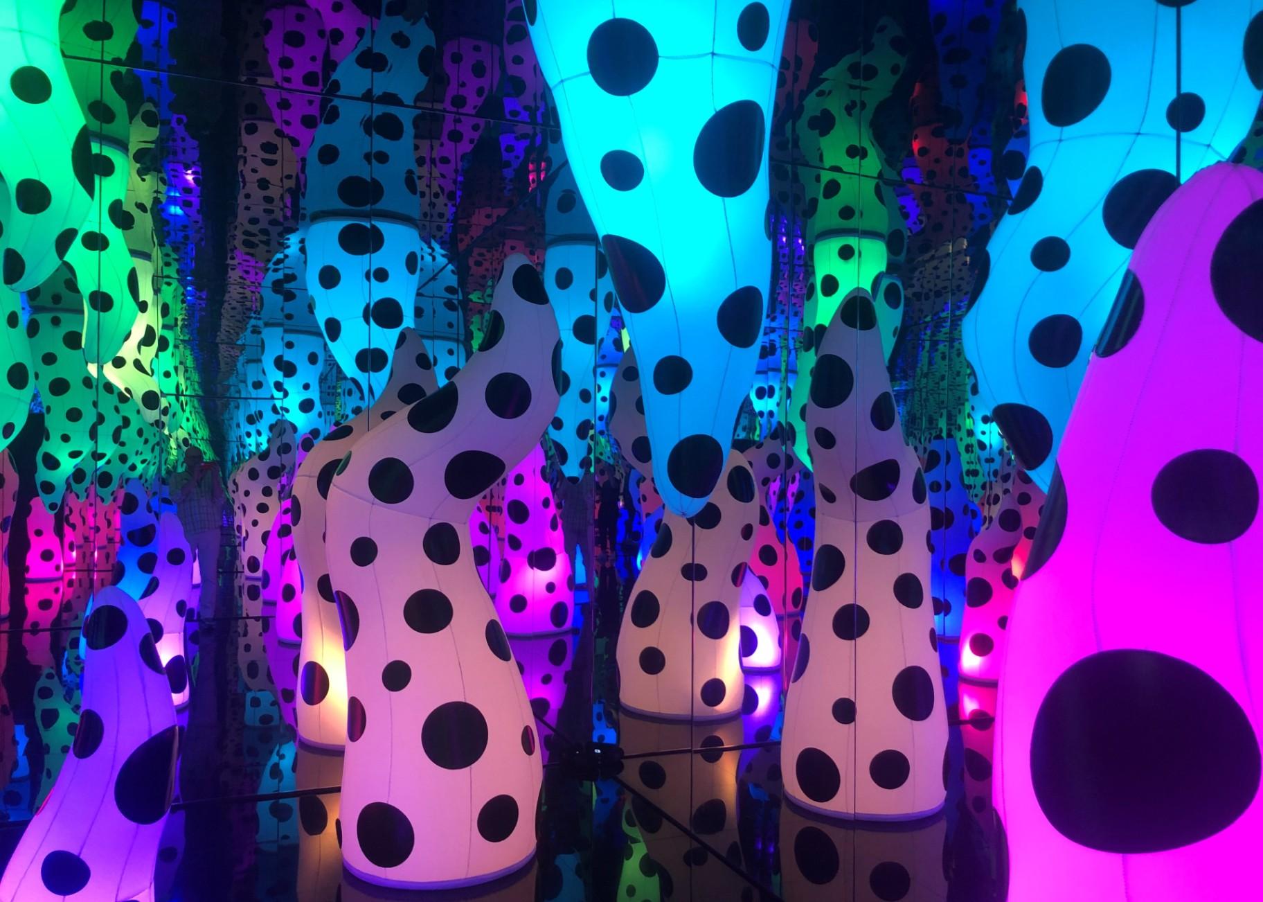 Yayoi Kusama created an installation called “Love is Calling.” It features polka dot tentacles rising up like stalagmites in an endless psychedelic cave. (Marc Vitali / WTTW News)