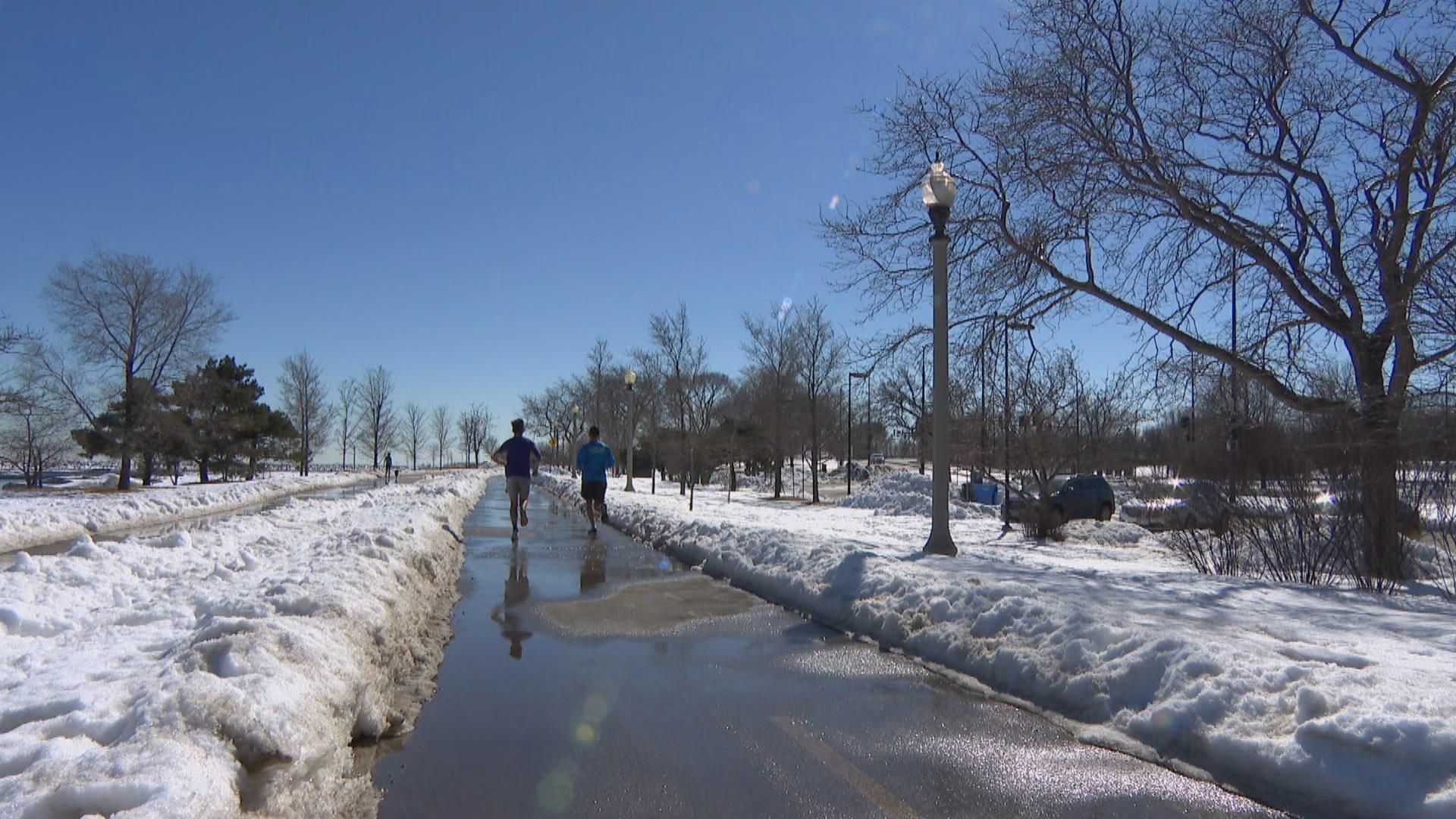 Joggers hit the Lakefront path amid melting snow and sunshine on Tuesday, Feb. 23, 2021. (WTTW News)