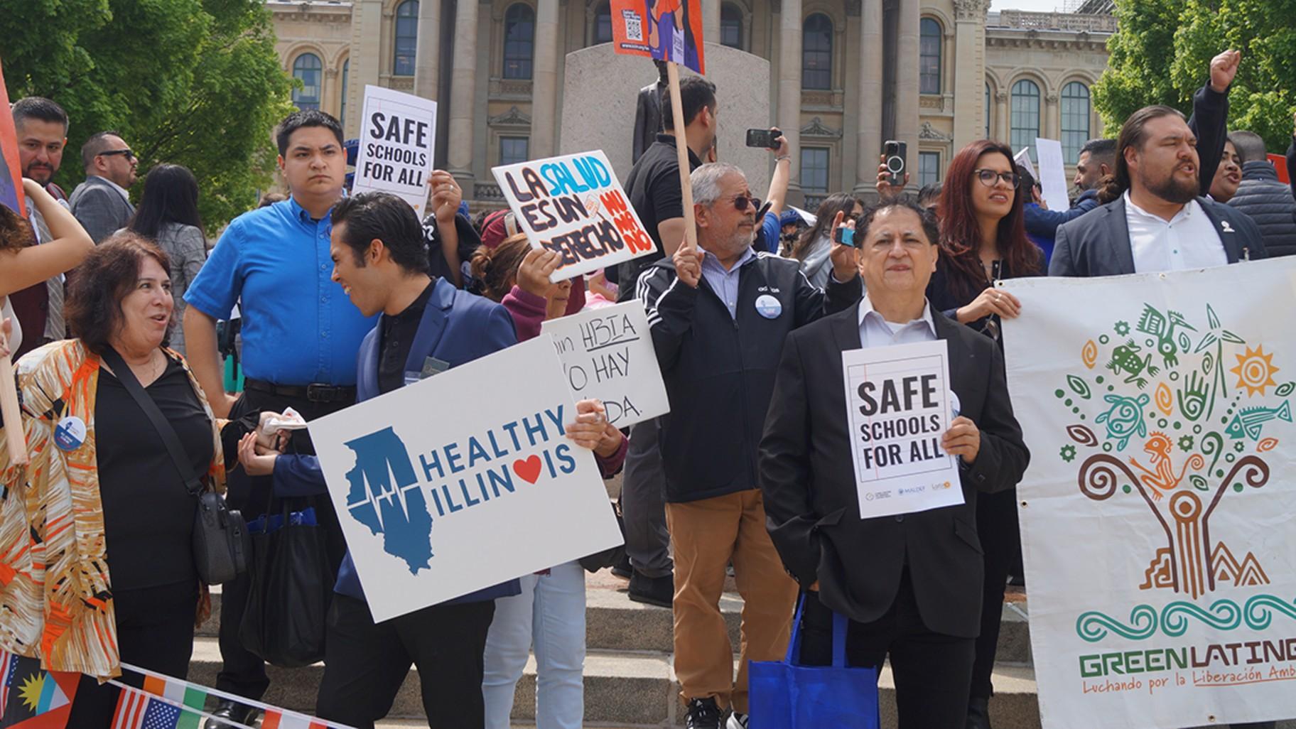 Immigrant rights advocates demonstrate outside the Illinois Statehouse for legislation protecting rights of noncitizens, including a bill meant to ensure the right of a free public K-12 education, regardless of a child’s immigration status. (Peter Hancock / Capitol News Illinois)