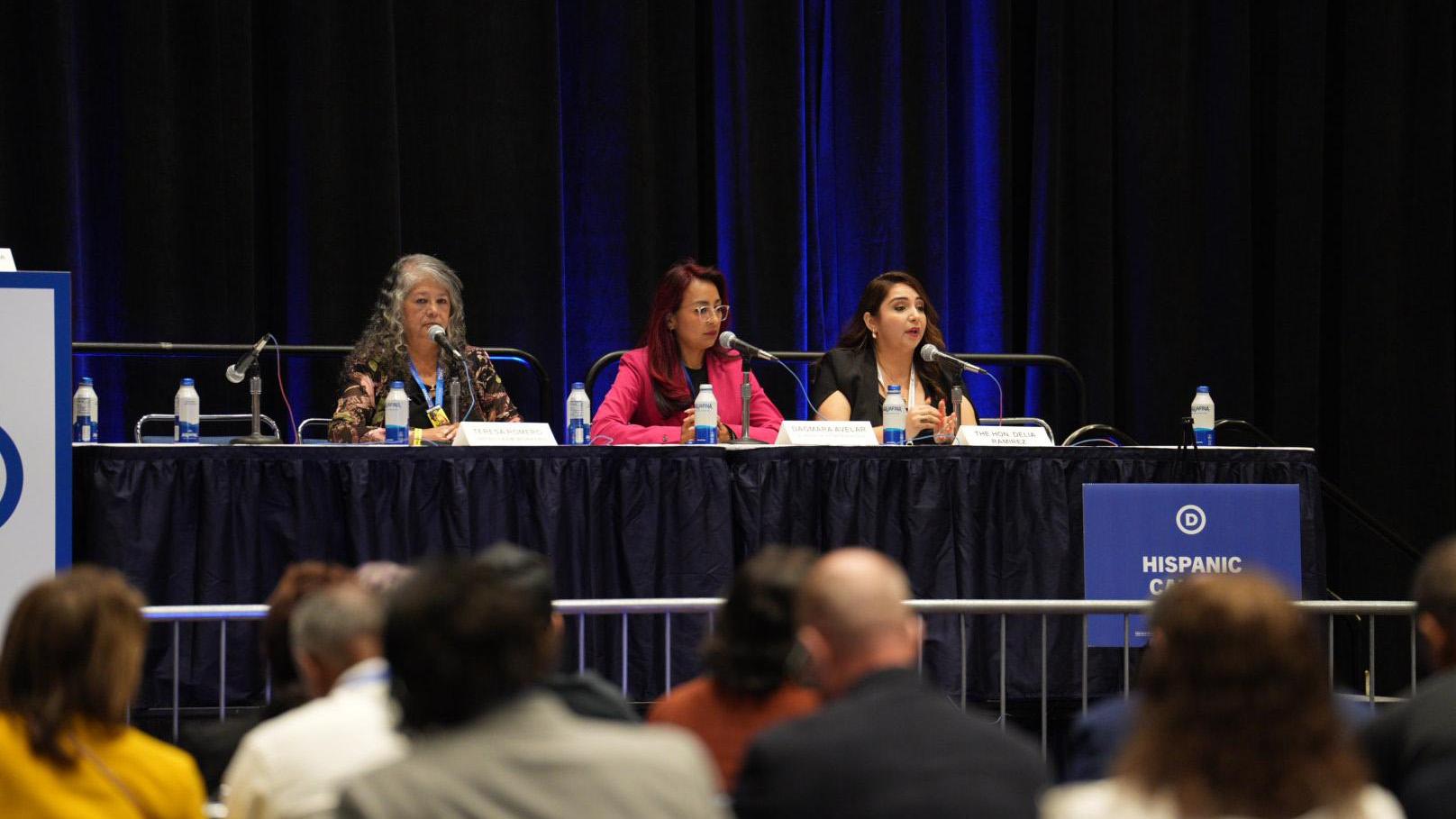 U.S. Rep. Delia Ramirez (D-Chicago) and State Rep. Dagmara Evelar, (D-Bolingbrook) speak on a panel about immigration at the Hispanic Democratic Caucus meeting on Wednesday, Aug. 21, 2024.