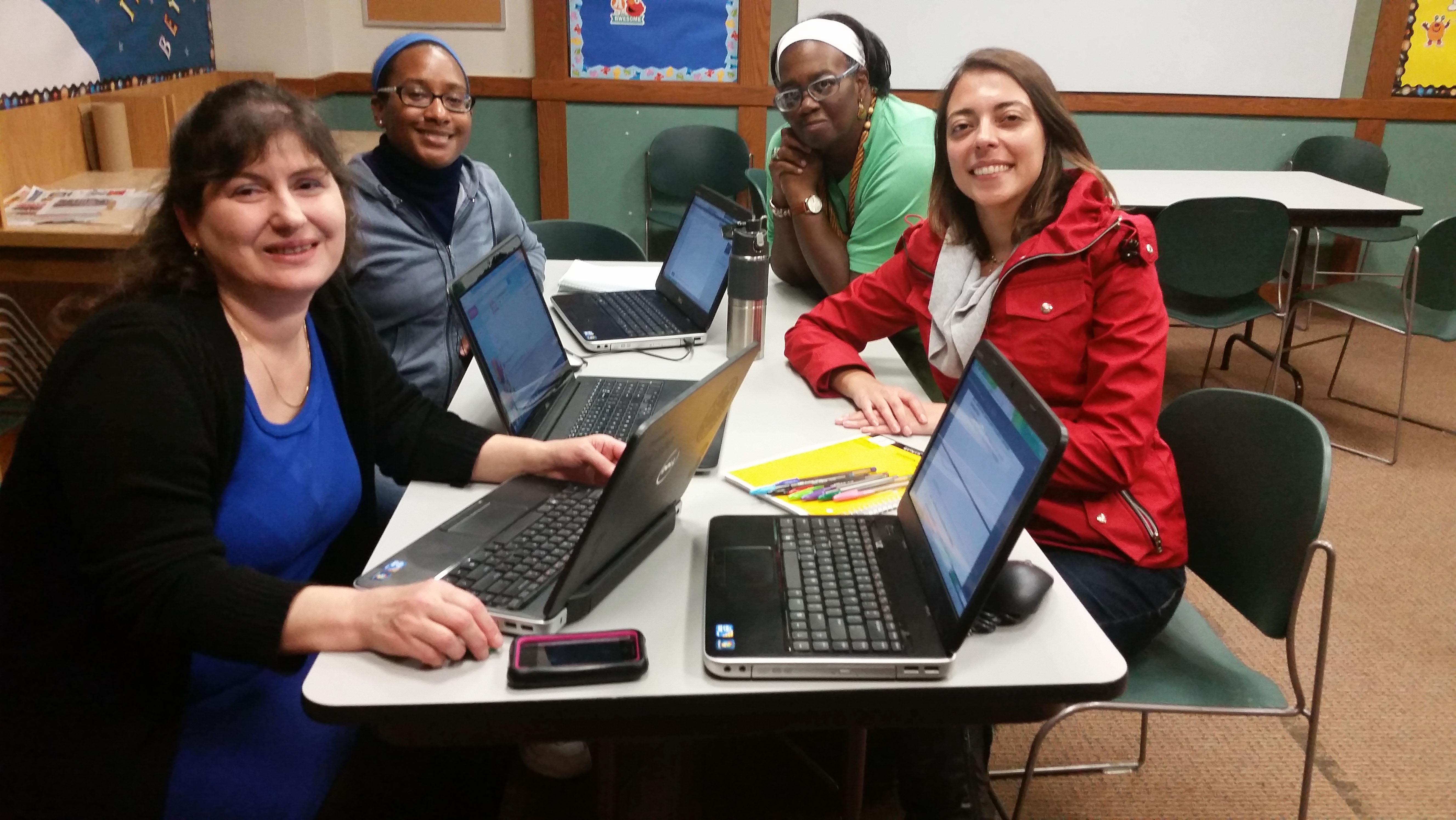 Four participants of a Learning Circle at the Whitney Young Library take a quick break to pose for a picture. (Courtesy of Chicago Public Library)