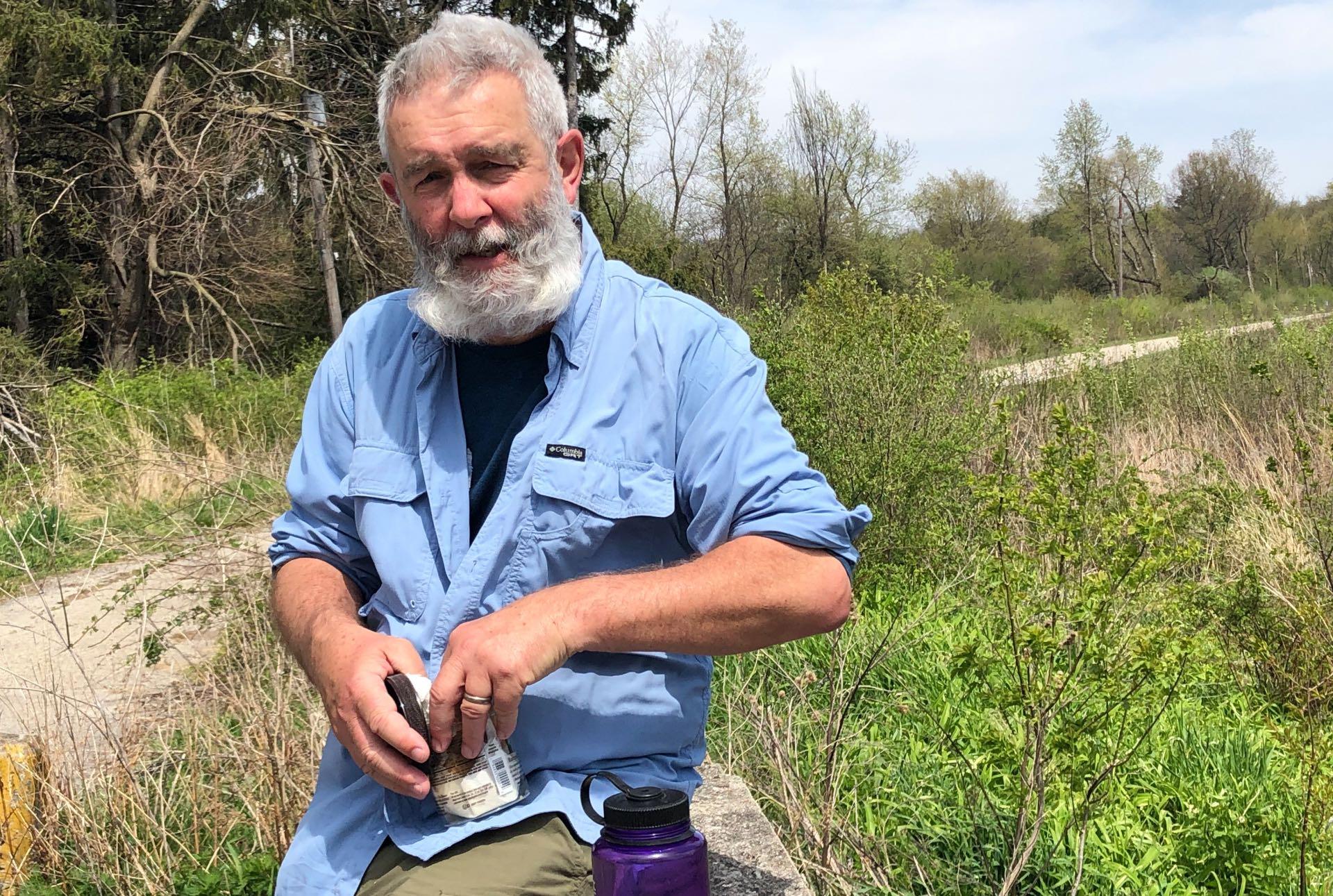 Lunch break. Liam Durnan at Spring Lake Nature Preserve. (Patty Wetli / WTTW News)