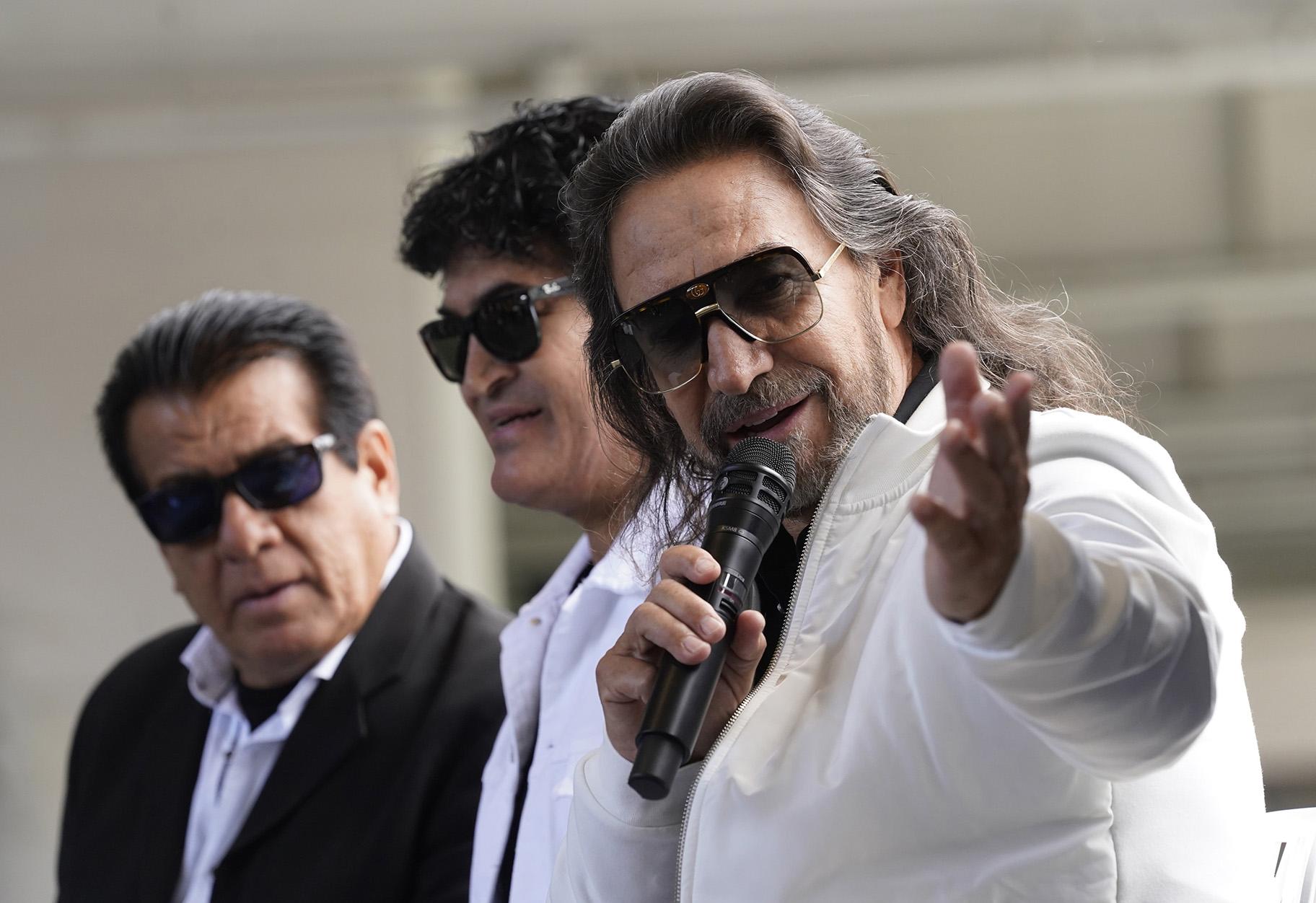 Members of the Mexican grupera band Los Bukis, from left, Pedro Sanchez, Roberto Guadarrama and Marco Antonio Solis attend a press conference at SoFi Stadium on Monday, June 14, 2021, in Inglewood, Calif. (AP Photo / Chris Pizzello)