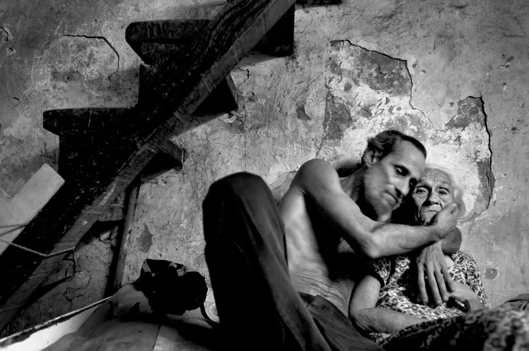 An impoverished mother and son embrace in Garcia’s photo “Love of the Son.” (Courtesy of Alex Garcia)