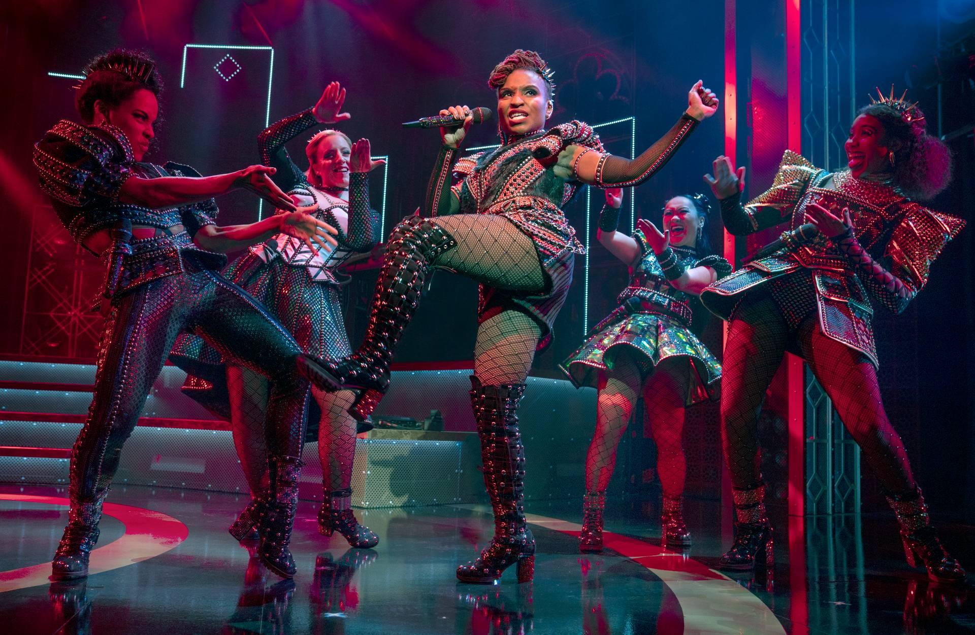 Brittney Mack portrays Anna of Cleves, center, during a performance of the musical “Six,” at Broadway’s Brooks Atkinson Theatre in New York. Mack is slated to perform a mashup of some of its songs with her castmates and band in front of a televised audience of millions at the Macy’s Thanksgiving Day Parade. (Joan Marcus / Boneau / Bryan-Brown via AP)