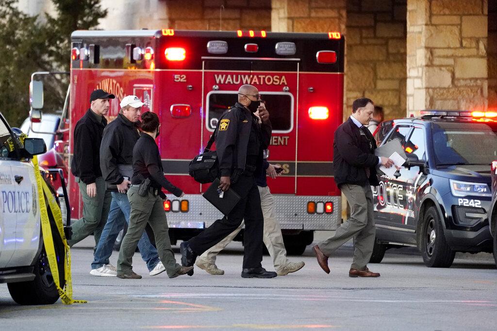 Police officials walk to the Mayfair Mall, Friday, Nov. 20, 2020, in Wauwatosa, Wis. (AP Photo / Nam Y. Huh)
