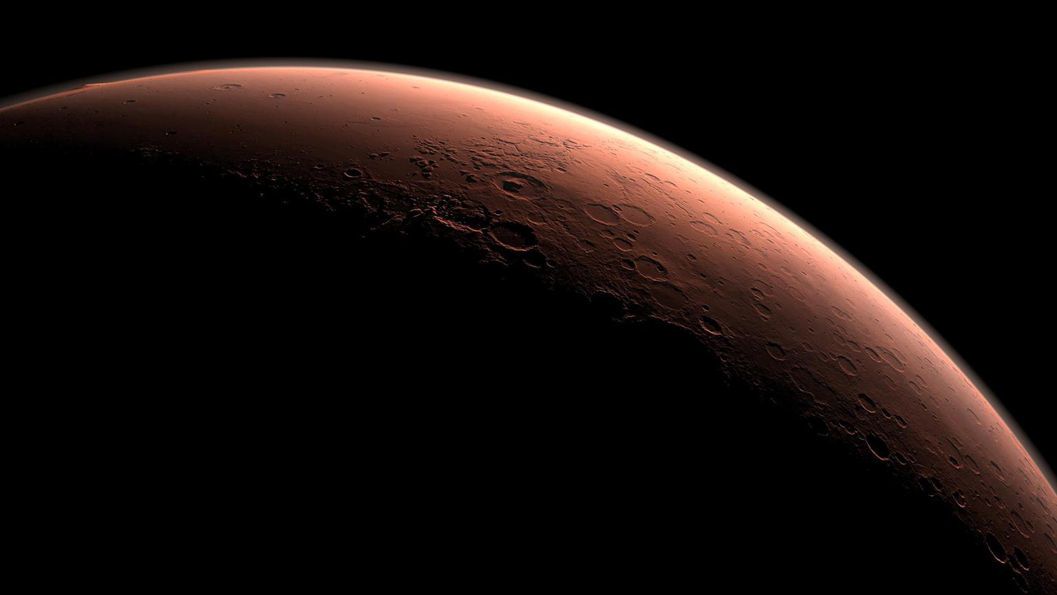 This computer-generated image depicts part of Mars at the boundary between darkness and daylight. (Credit: NASA/JPL-Caltech)