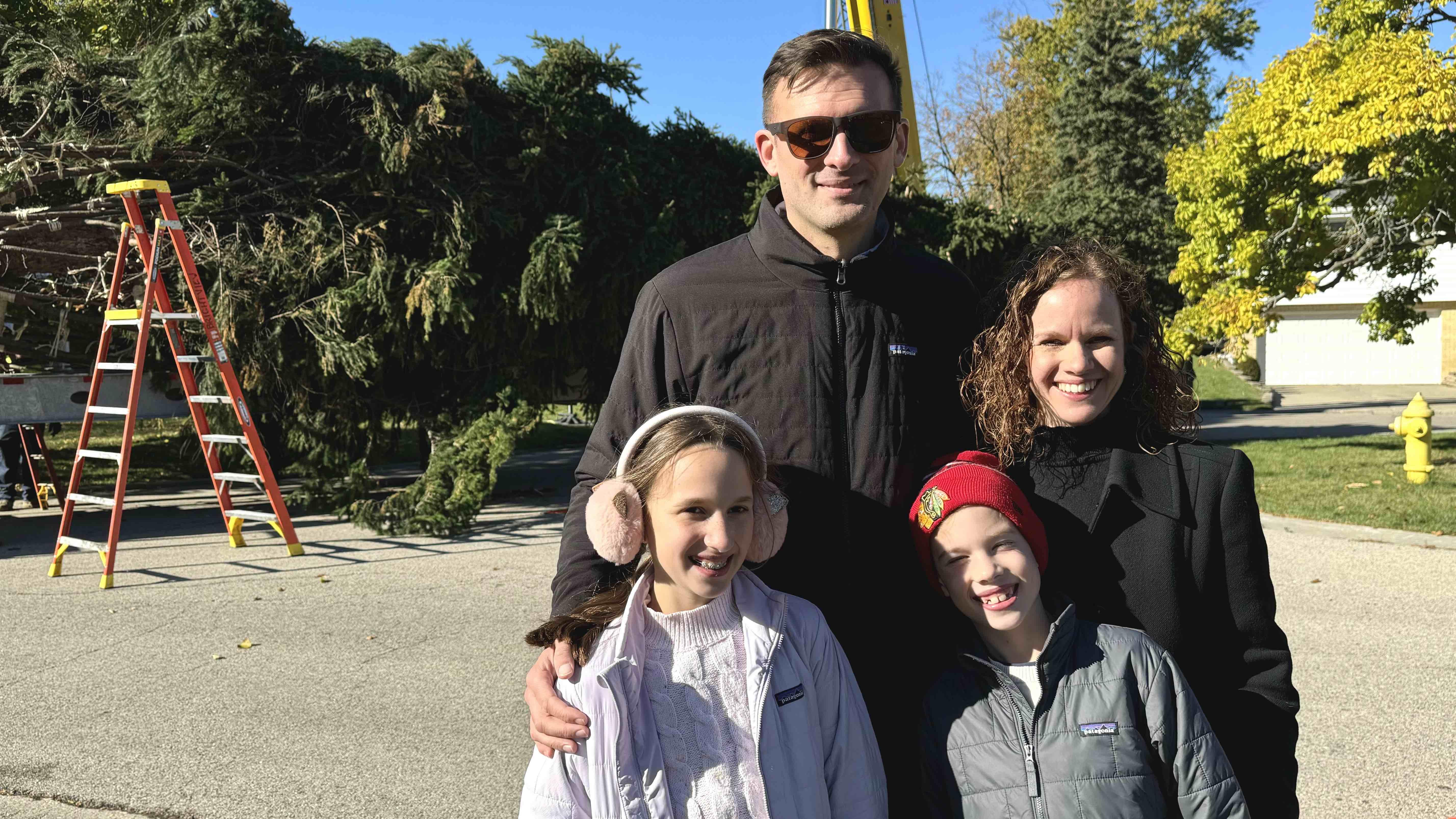 The Mason family donated the Norway spruce. Clockwise from top left: Ryan, Jody, Lucas and Evelyn. “I’m definitely going to tell my friends. I’ve been waiting a week to tell them,” said 11-year-old Evelyn. (Patty Wetli / WTTW News)