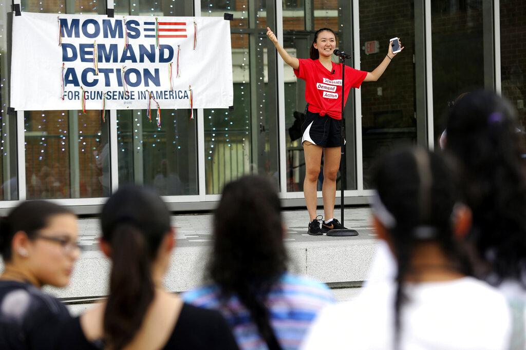 In this Aug. 11, 2019, file photo, Seo Yoon “Yoonie” Yang, with Students Demand Action, speaks during a vigil to remember the victims of the El Paso, Texas, and Dayton, Ohio, mass shootings and call for lawmakers to take action against gun violence at Miller Park in Chattanooga, Tenn. (Erin O. Smith / Chattanooga Times Free Press via AP)