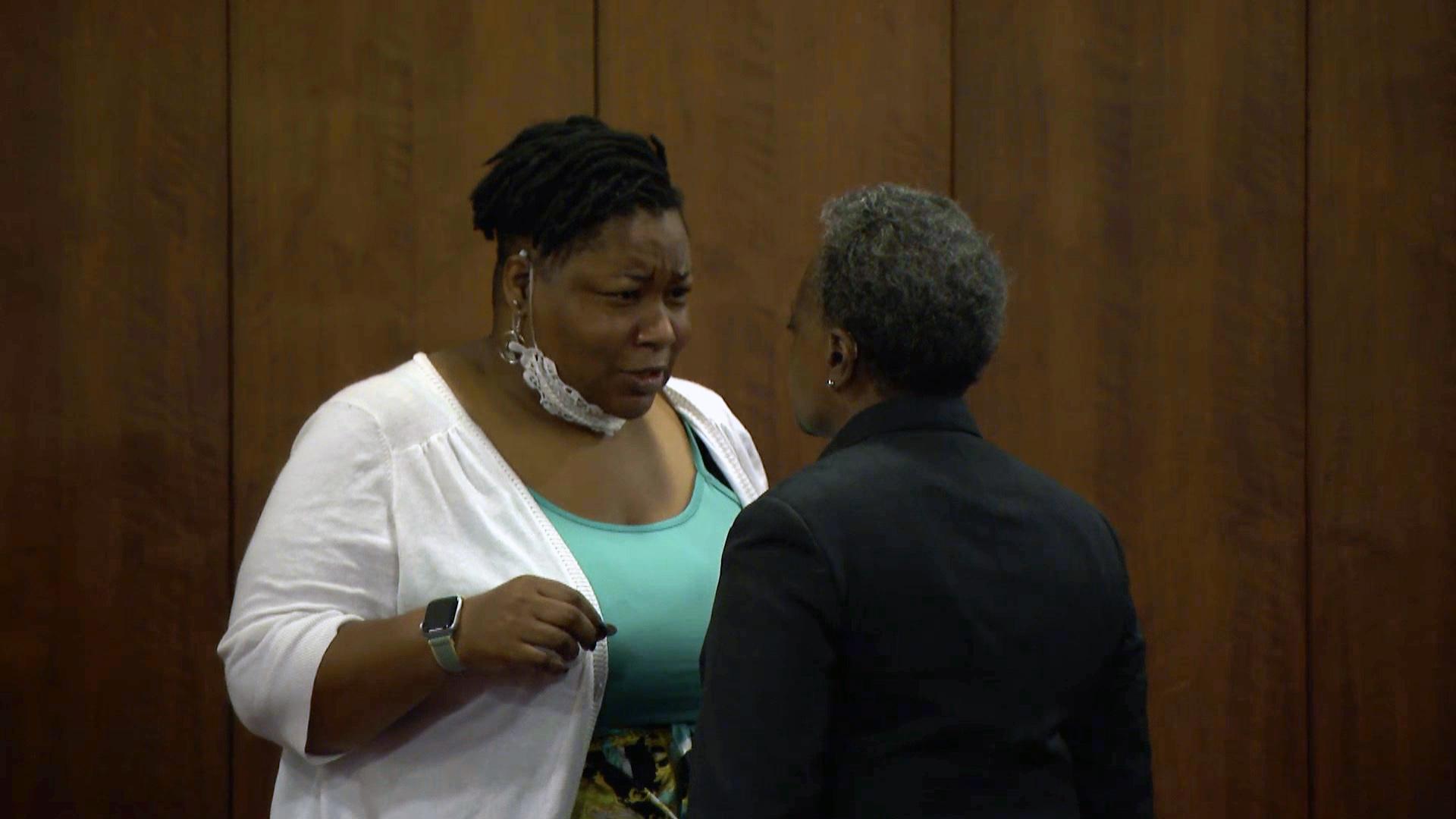 Ald. Jeanette Taylor (20th Ward), left, speaks with Mayor Lori Lightfoot at a City Council meeting Wednesday, June 23, 2021. (WTTW News)