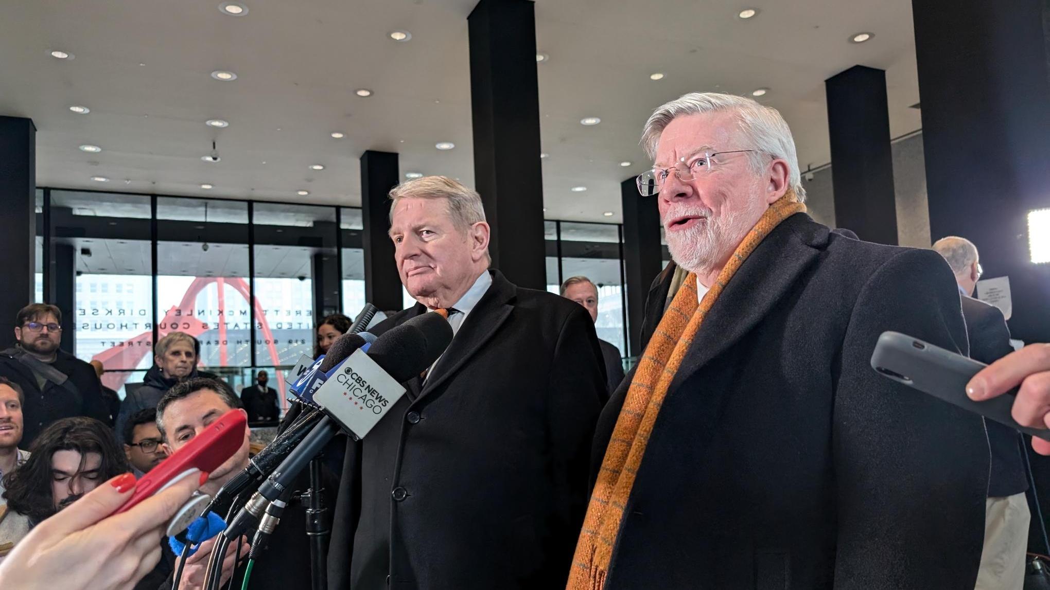 Michael McClain, left, and his attorney Patrick Cotter speak in the lobby of the Dirksen Federal building on Feb. 12, 2025. (Matt Masterson / WTTW News)