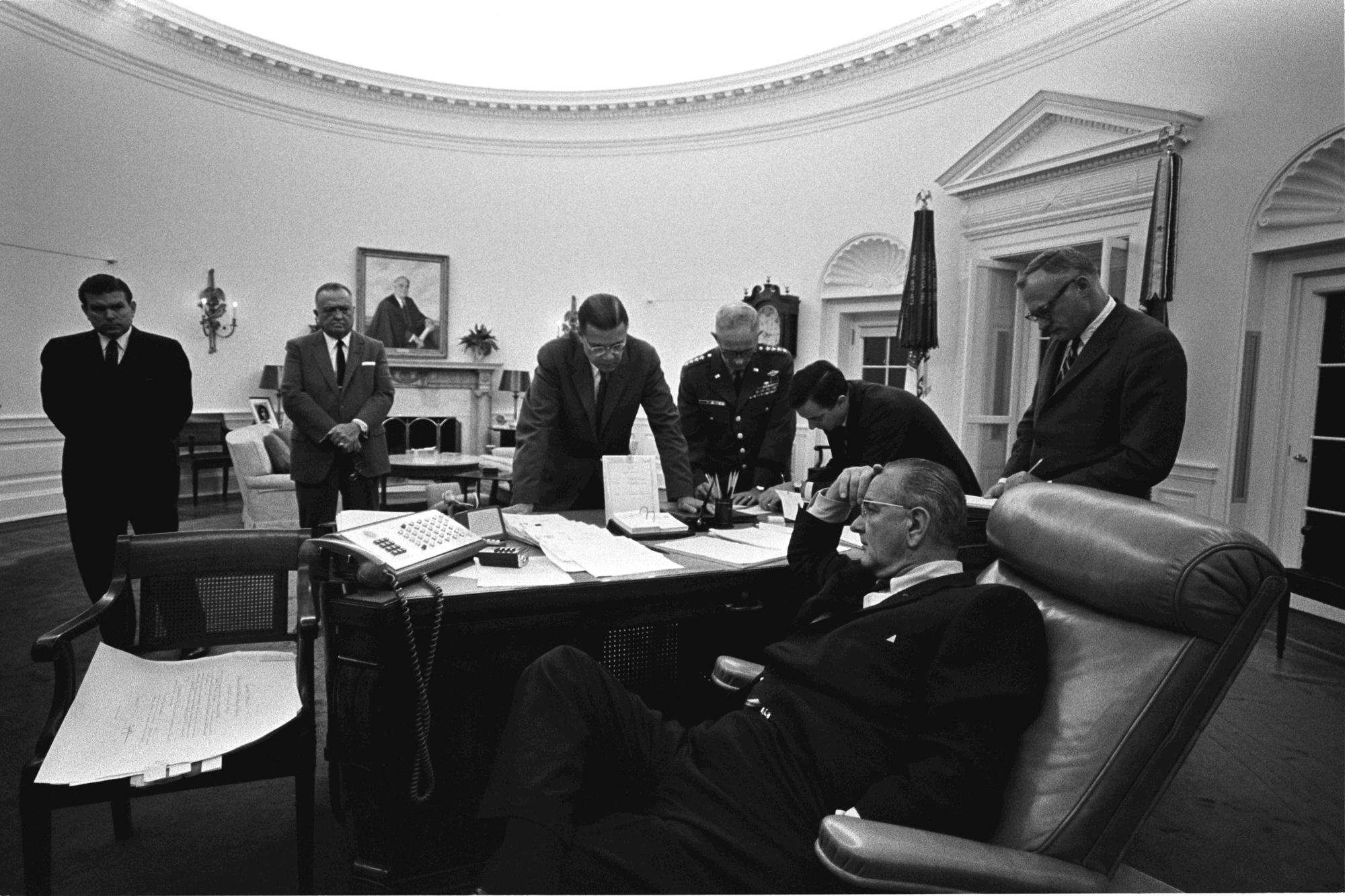 President Lyndon B. Johnson, seated, discusses the 1967 Detroit riot with members of his staff in the Oval Office. (LBJ Library photo by Yoichi Okamoto)