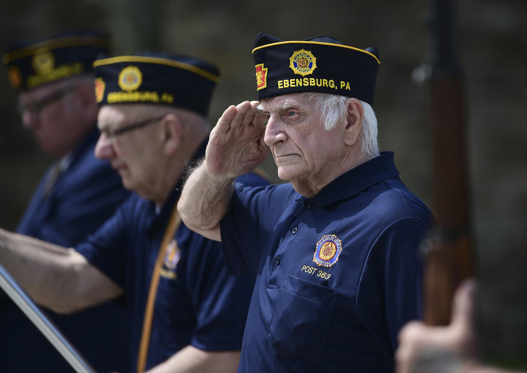 U.S. Army veteran Joseph Lesniak of Colver, Pa., salutes during the playing of Taps at a Memorial Day ceremony at Soldiers and Sailors Memorial Park, in Ebensburg, Pa., Monday, May 25. 2020. (John Rucosky / The Tribune-Democrat via AP)