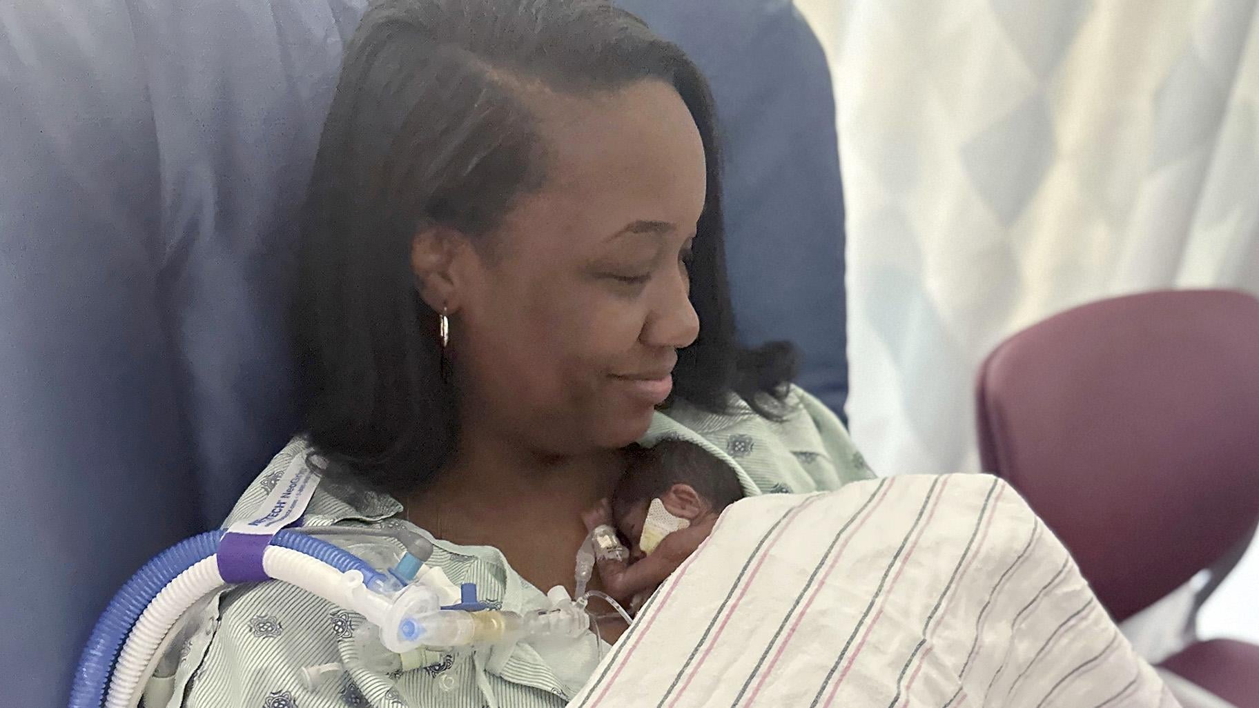 This undated photo shows mother NaKeya Haywood holding 6-month-old Nyla Brooke Haywood, a baby girl born Nov. 17, 2023, at Silver Cross Hospital in New Lenox, Ill. (NaKeya Haywood via AP)