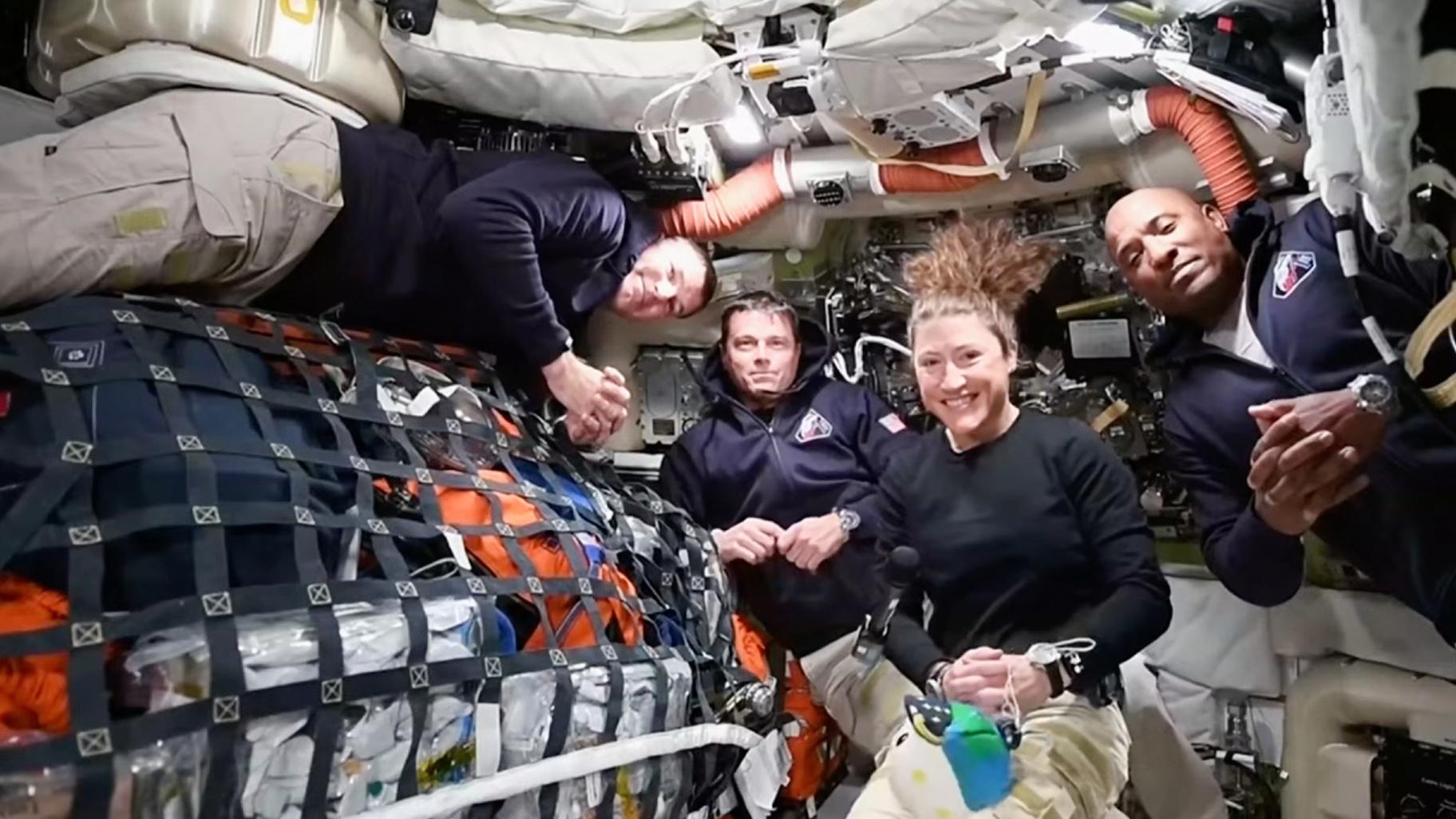 This image from video provided by NASA shows the Artemis II crew, from left, Canadian astronaut and mission specialist Jeremy Hansen, Commander Reid Wiseman, mission specialist Christina Koch and pilot Victor Glover as they speak with NASA Mission Control in a video conference while en route to the moon, Thursday, April 2, 2026. (NASA via AP)