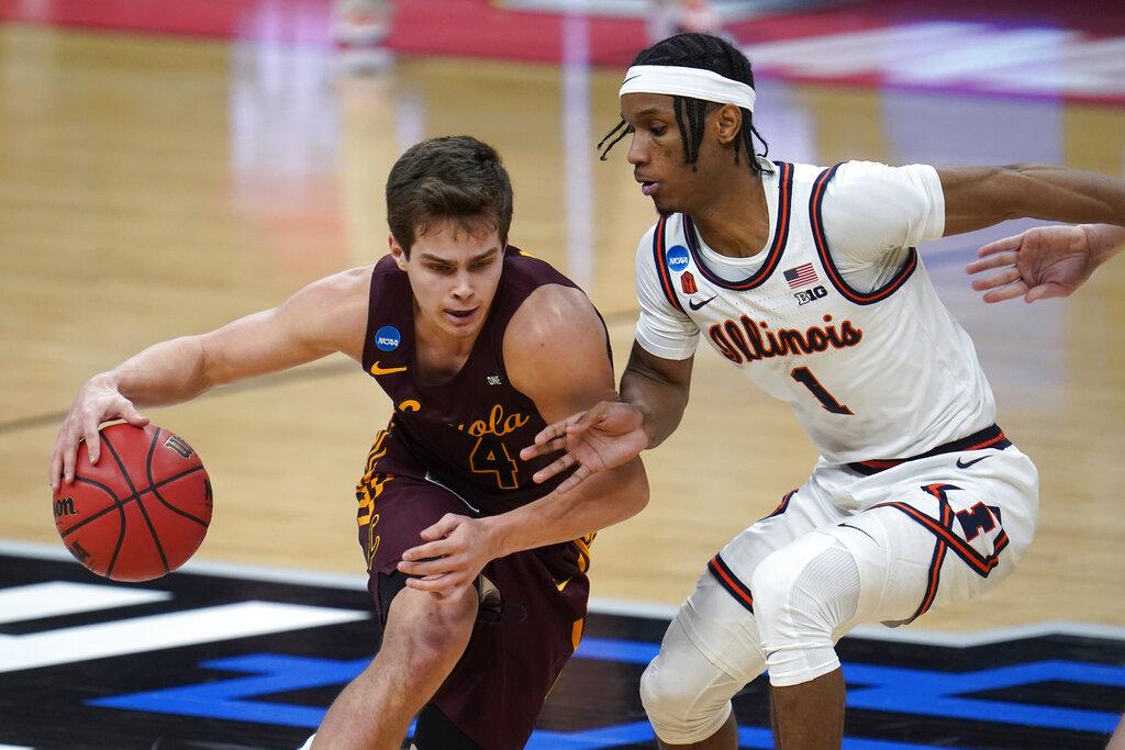 Loyola Chicago guard Braden Norris (4) drives on Illinois guard Trent Frazier (1) during the second half of a men’s college basketball game in the second round of the NCAA tournament at Bankers Life Fieldhouse in Indianapolis, Sunday, March 21, 2021. (AP Photo / Paul Sancya)