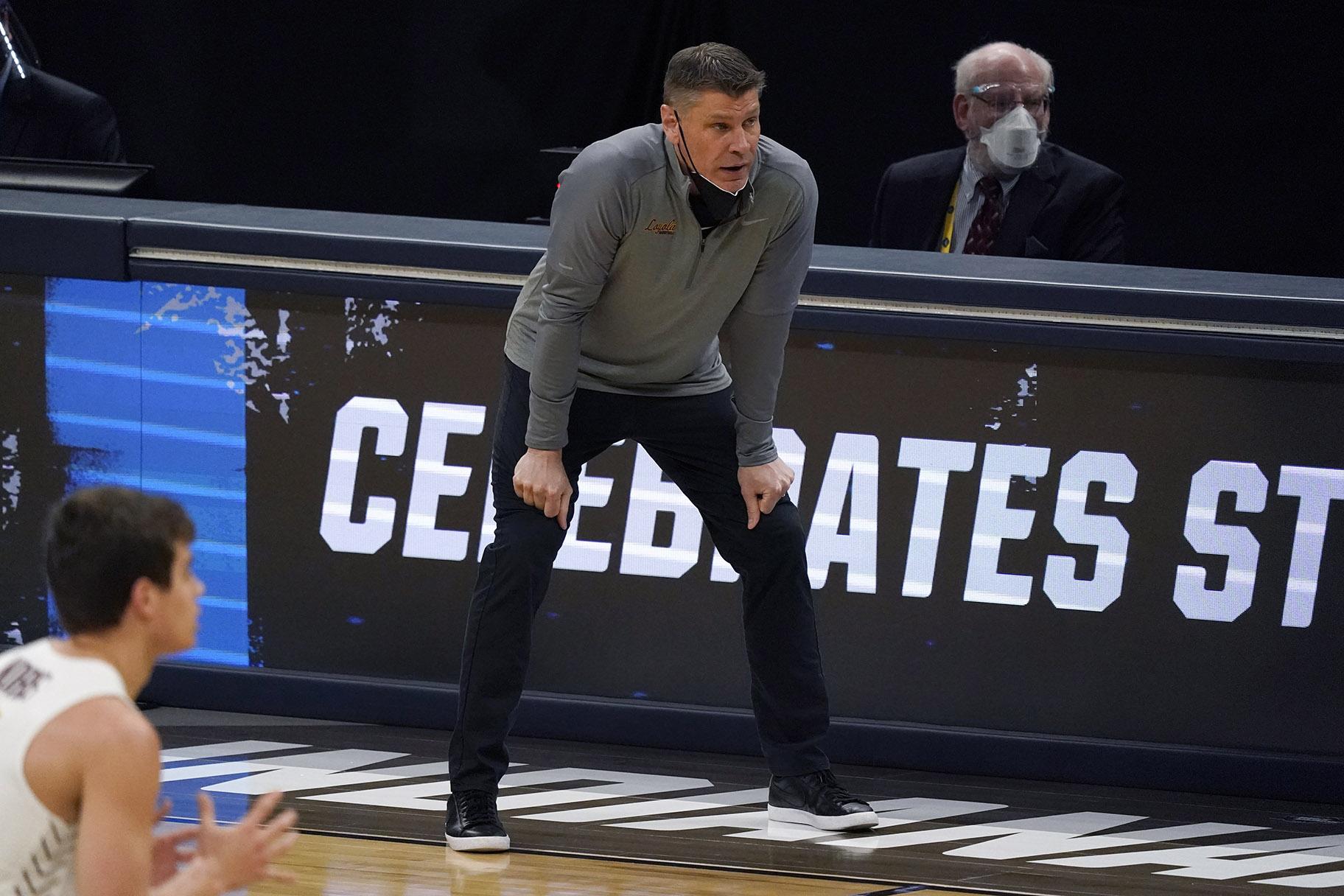 Loyola Chicago head coach Porter Moser watches from the bench during the first half of a Sweet 16 game against Oregon State in the NCAA men’s college basketball tournament at Bankers Life Fieldhouse, Saturday, March 27, 2021, in Indianapolis. (AP Photo / Jeff Roberson)