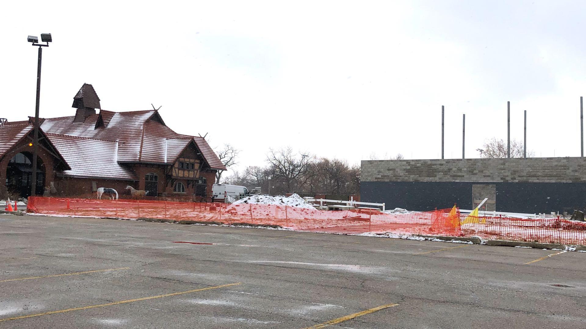 The landmarked Receptory Building and Stable, in relation to the archive facility. Critics argue the new building obscures views from the west and dominates the approach to the landmarked building from its parking lot. (Patty Wetli / WTTW News)