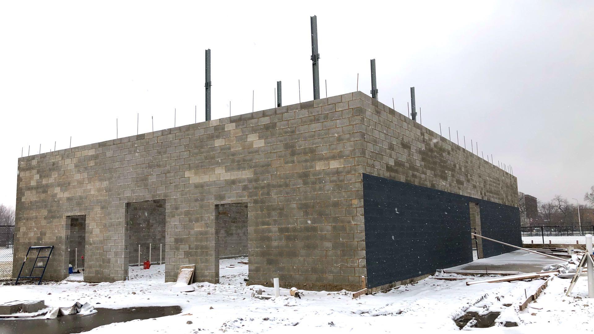 The half-finished shell of the archive facility. The dark gray paint was used to cover graffiti. (Patty Wetli / WTTW News)