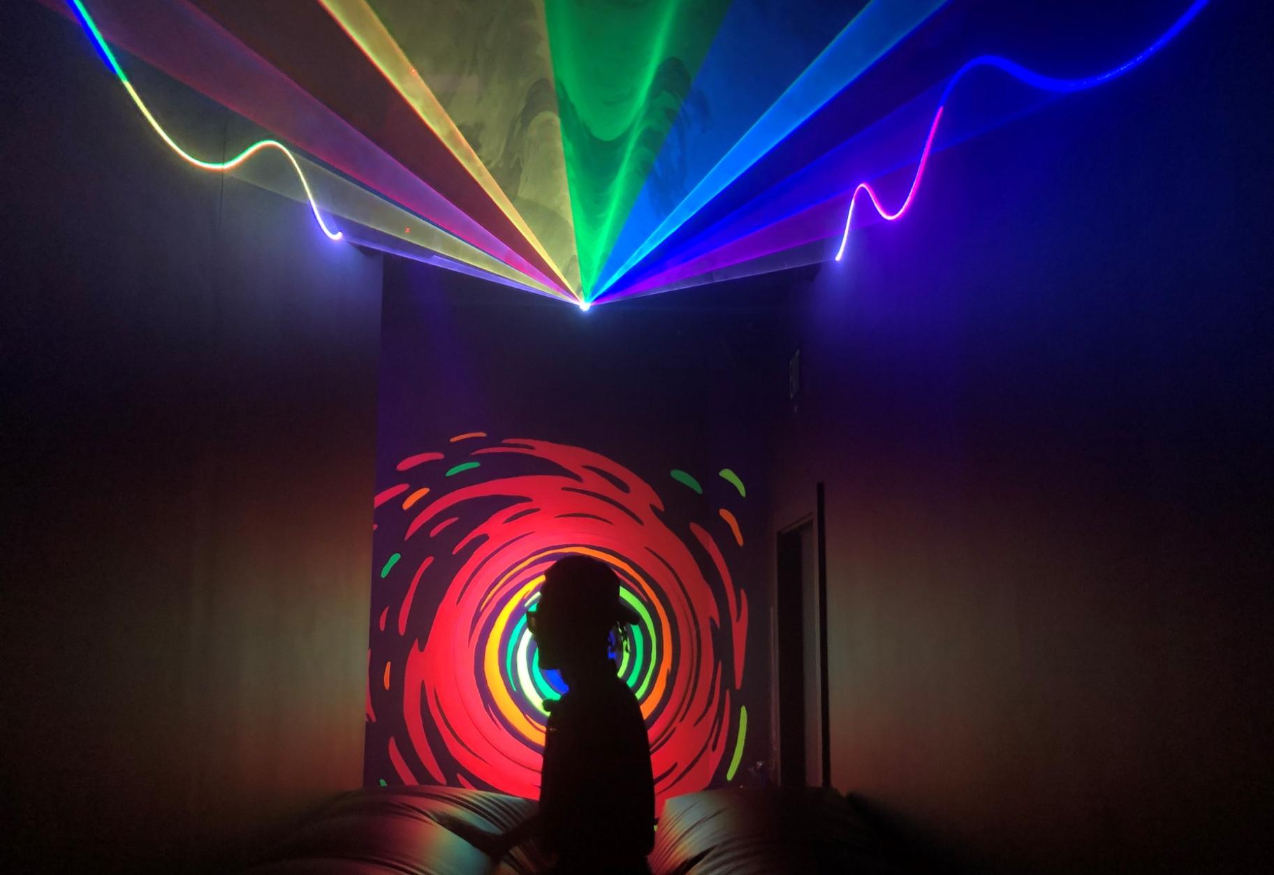 A person walks through WNDR Museum in the West Loop. (Marc Vitali / WTTW News)