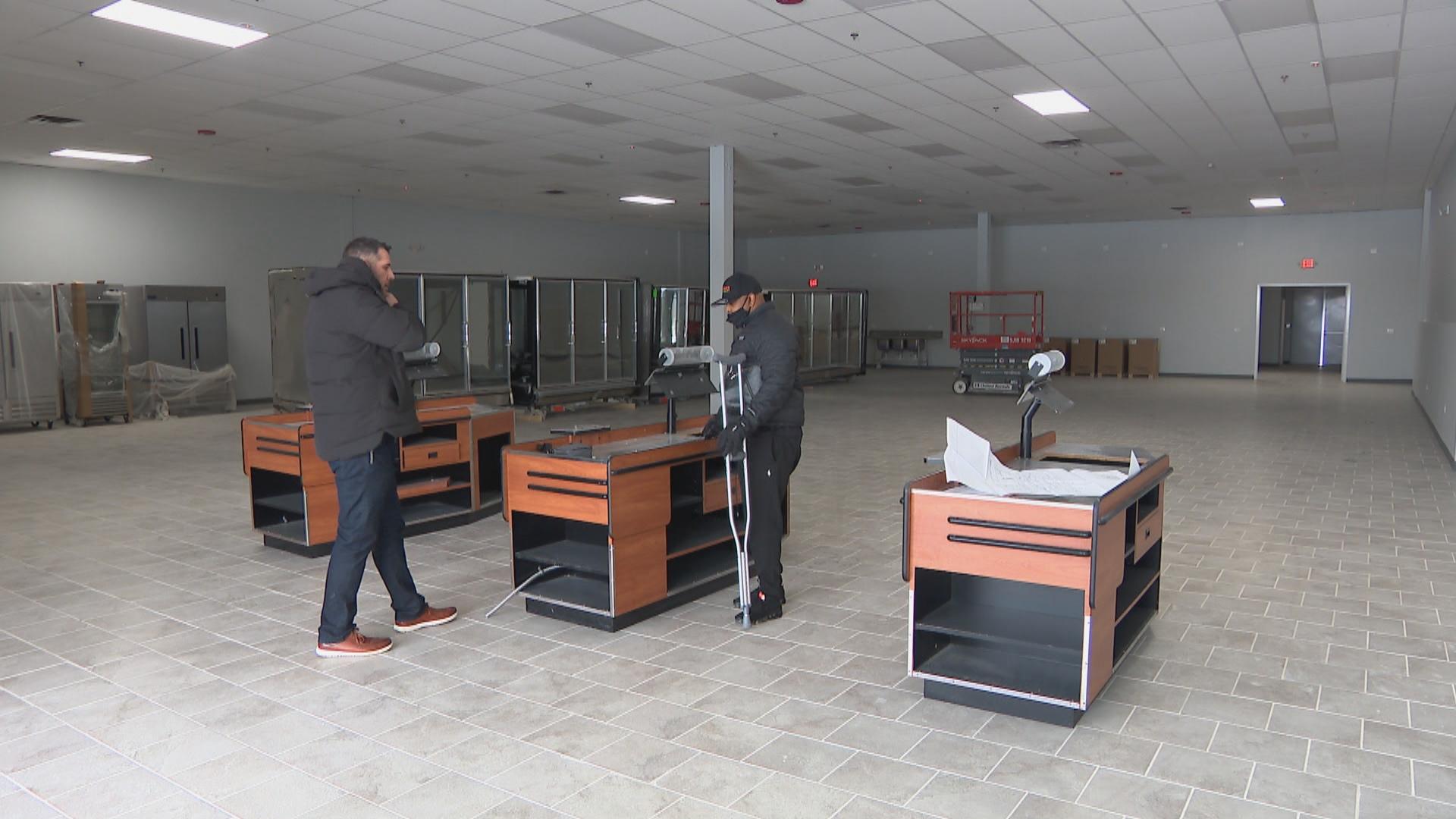 Peter Dremonas, left, and George Anderson, owners of George’s Fresh Market, stand in the space of their future North Chicago grocery store on Feb. 10, 2021. (WTTW News)