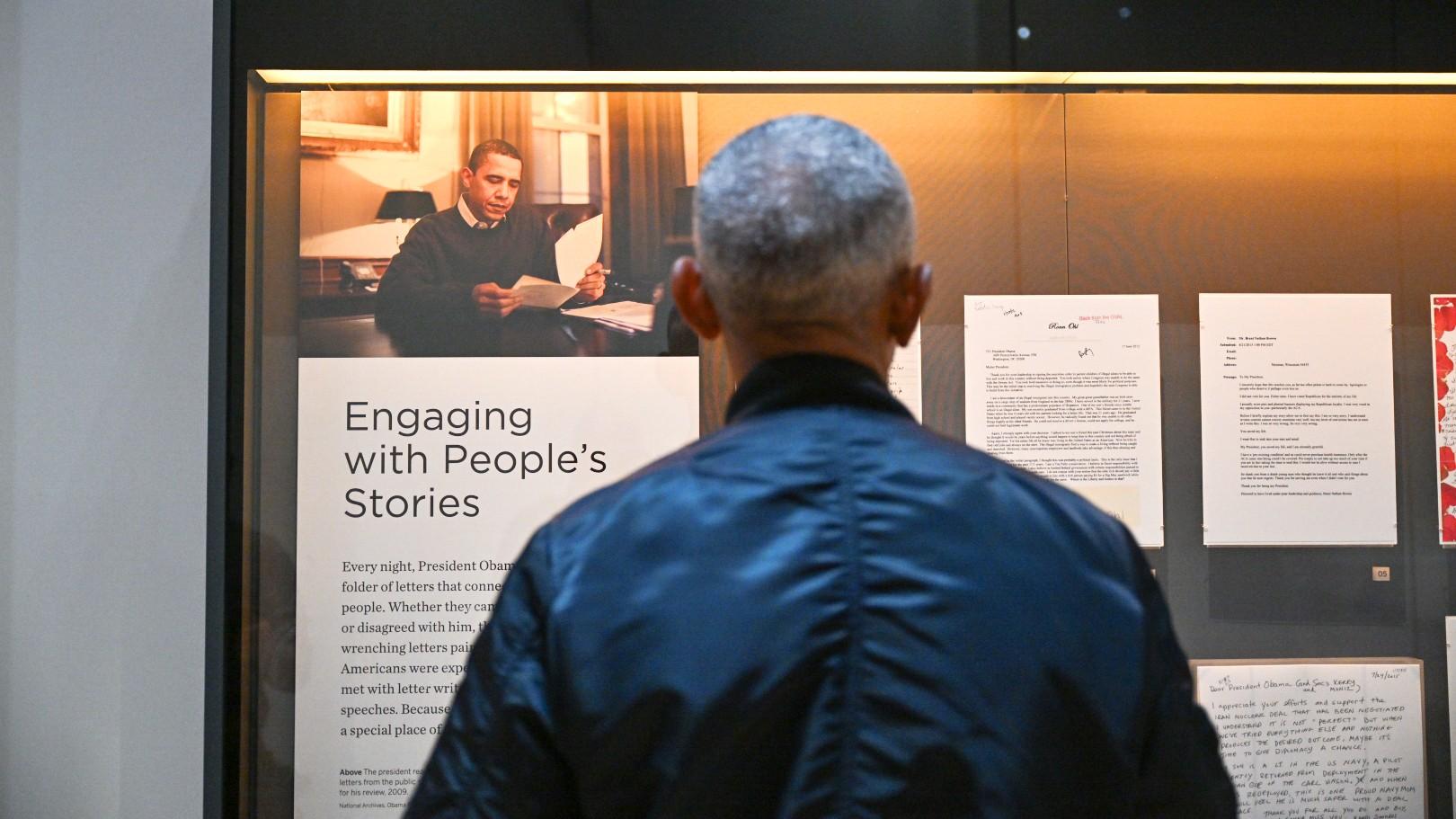 Former President Barack Obama takes in an exhibit during a recent visit to the Obama Presidential Center. (Courtesy of Obama Presidential Center)