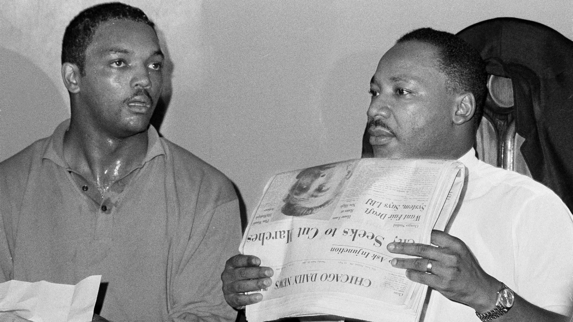 Civil rights leader Dr. Martin Luther King, Jr., right, and his aide Rev. Jesse Jackson are seen in Chicago, Aug. 19, 1966. (AP Photo / Larry Stoddard, File)