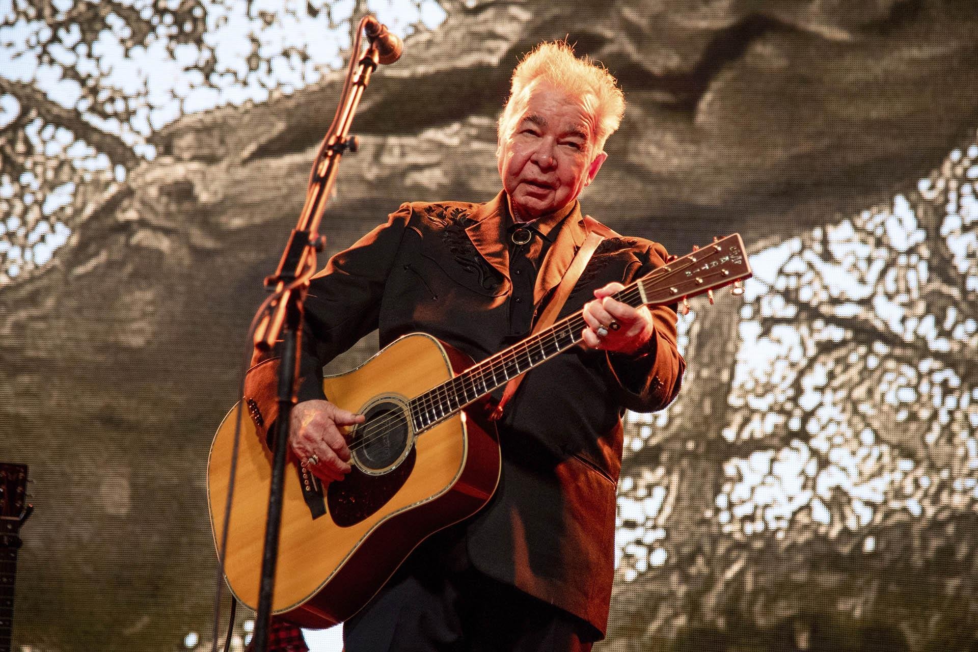 This June 15, 2019 file photo shows John Prine performing at the Bonnaroo Music and Arts Festival in Manchester, Tennessee. (Photo by Amy Harris / Invision / AP, File)