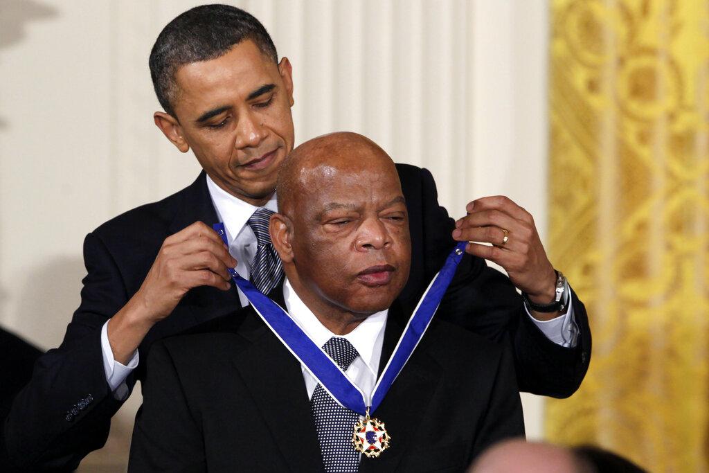 In this Feb. 15, 2011, file photo, President Barack Obama presents a 2010 Presidential Medal of Freedom to U.S. Rep. John Lewis, D-Ga., during a ceremony in the East Room of the White House in Washington. (AP Photo / Carolyn Kaster, File)